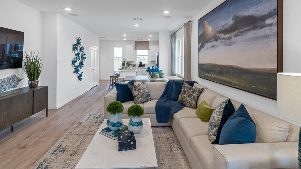 Family room is welcoming and spacious for comfortable seating, with a seat for everyone to enjoy conversation or watching movies.