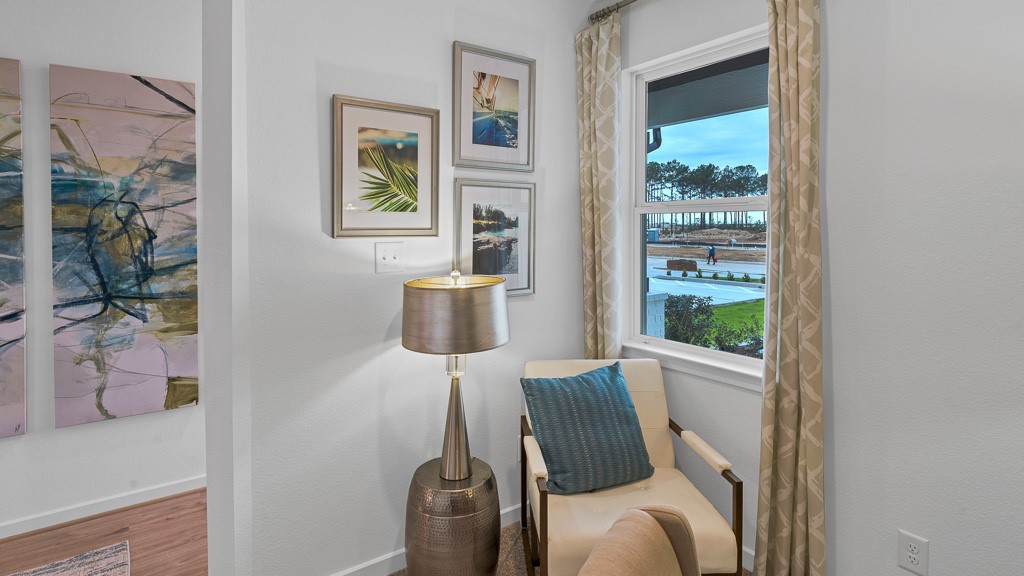 Designer white walls are appealing and custom drapery gives an upscale feel in home office.