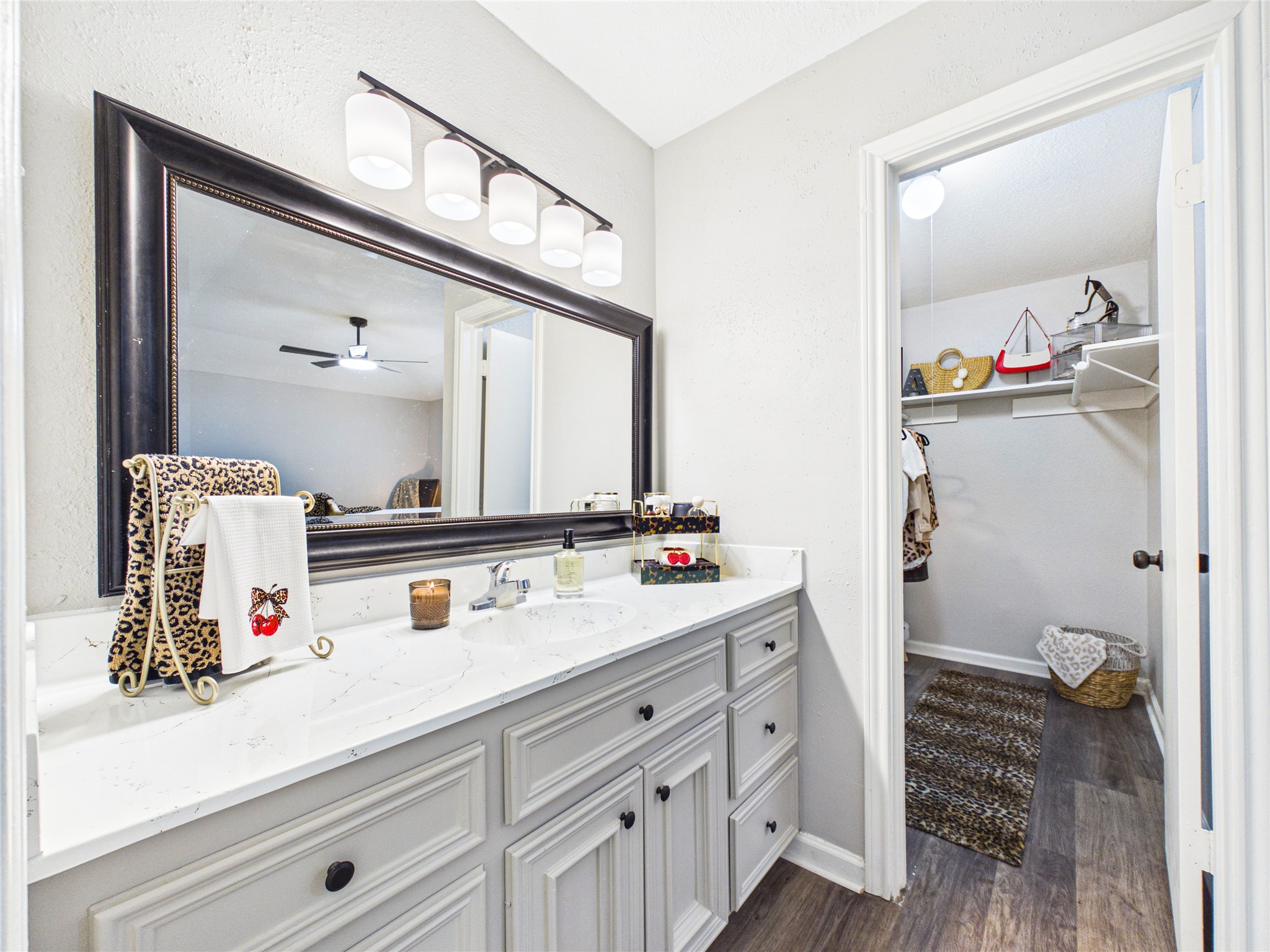 Another view of the Primary Bathroom and the walk-in closet.