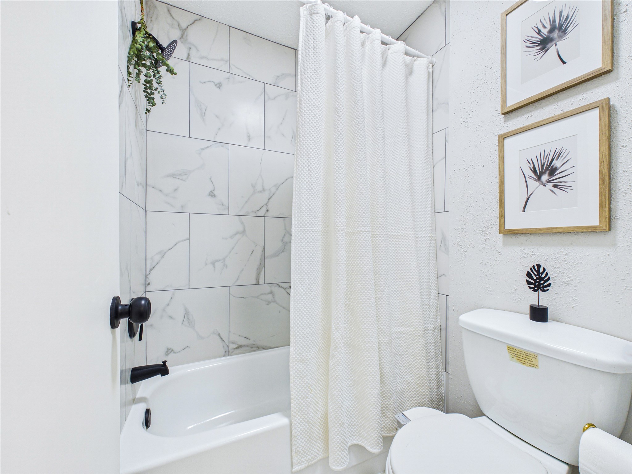 Primary Bathroom featuring brand new tile surround.