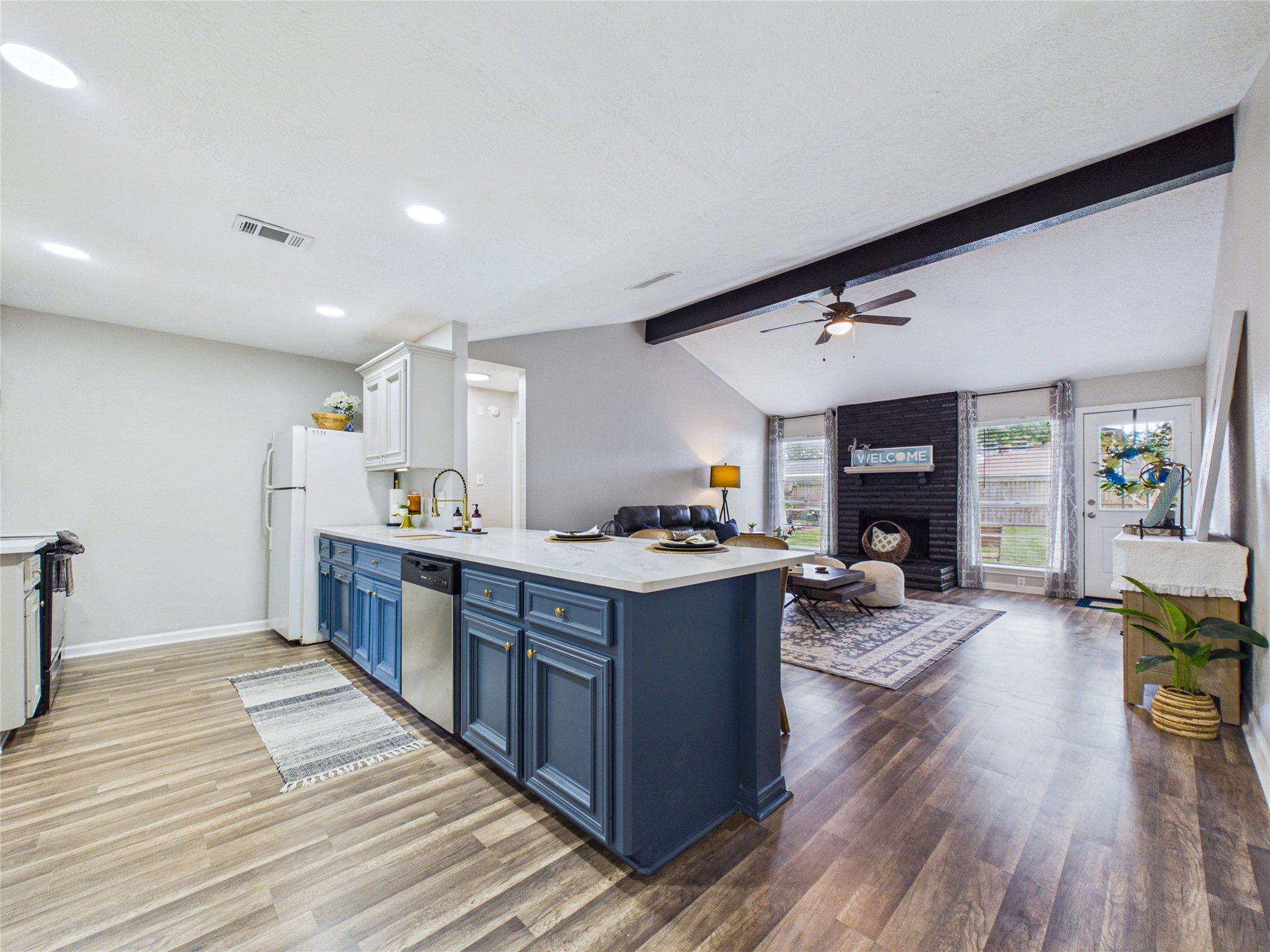 The updated lighting throughout the home stands out in the kitchen.