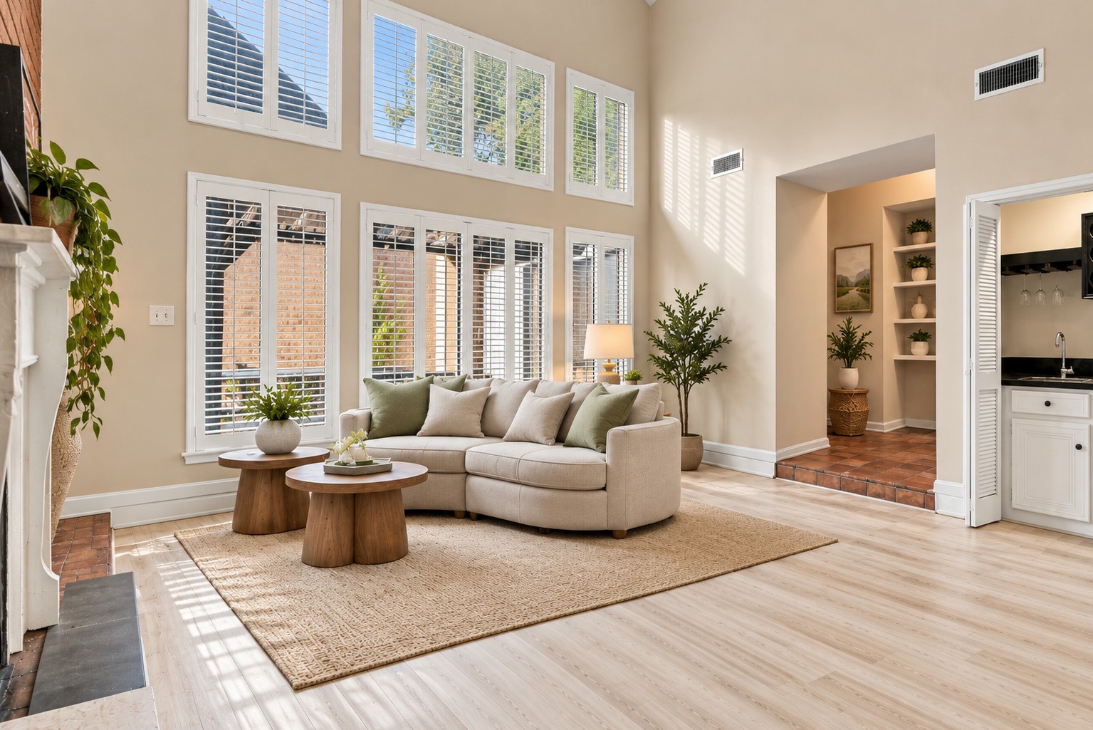 Virtually staged living room featuring soaring ceilings, dramatic windows, and a comfortable seating arrangement. Virtually staged living room featuring soaring ceilings, dramatic windows, and a comfortable seating arrangement.