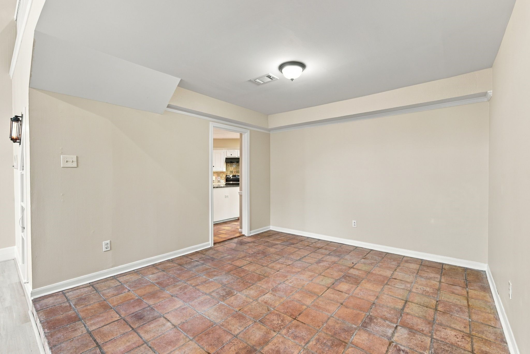 Additional perspective of the formal dining room highlighting its flexible layout and proximity to the kitchen.