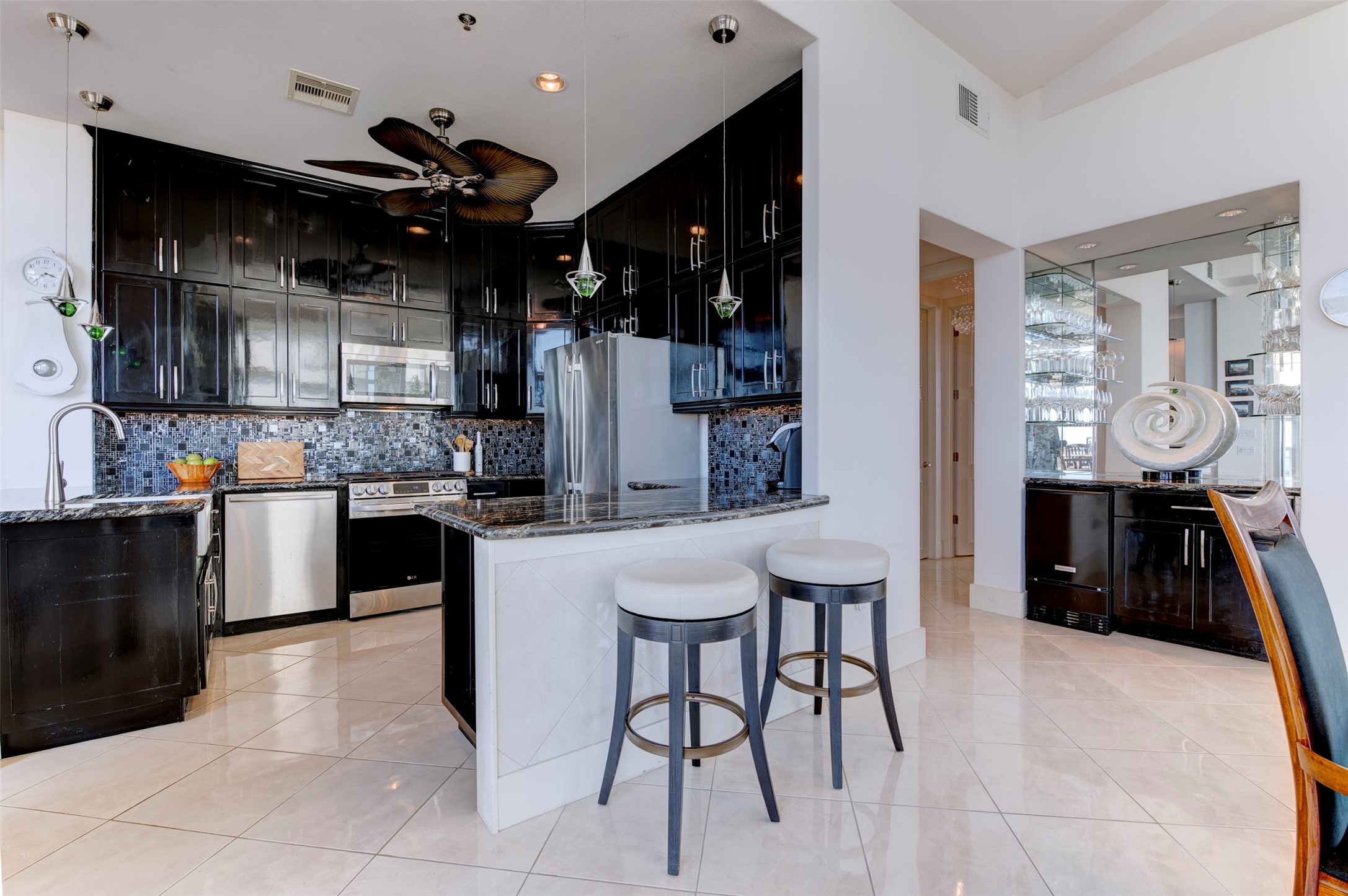 Expansive penthouse kitchen with dramatic floor-to-ceiling cabinetry and exceptional storage Expansive penthouse kitchen with dramatic floor-to-ceiling cabinetry and exceptional storage