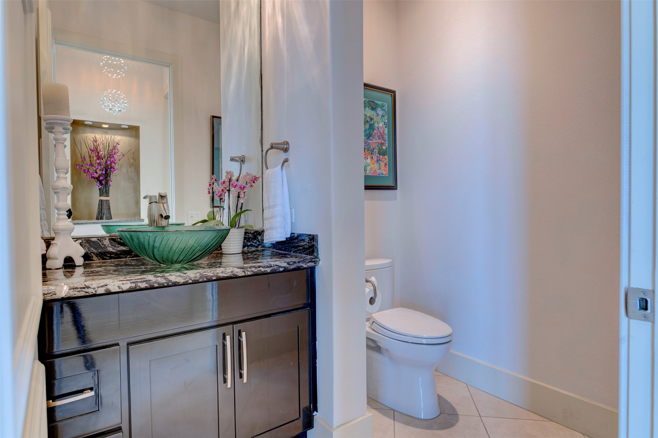 Guest half bath near the entry provides easy access from the main living spaces.