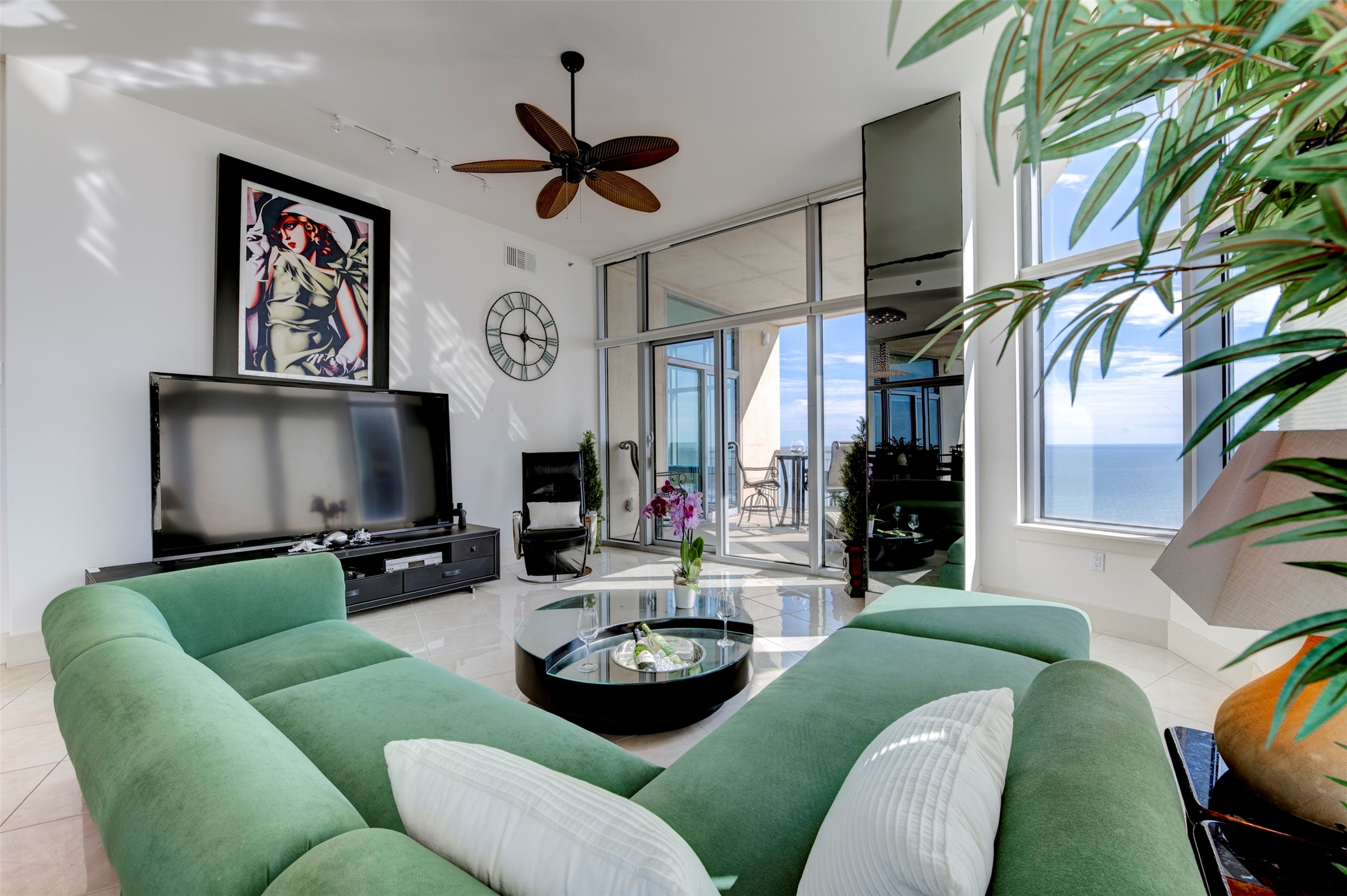 Oversized living area opens directly to the balcony, with Gulf views visible from throughout the room. Oversized living area opens directly to the balcony, with Gulf views visible from throughout the room.