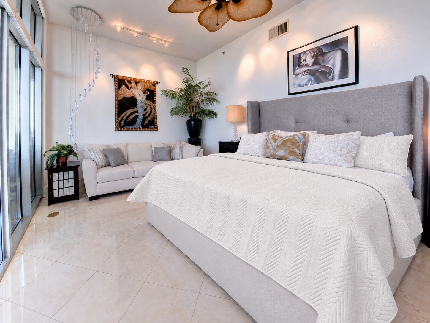 One of two spacious primary suites, featuring 11'4? penthouse ceilings and a sitting area beside the balcony doors. One of two spacious primary suites, featuring 11'4? penthouse ceilings and a sitting area beside the balcony doors.