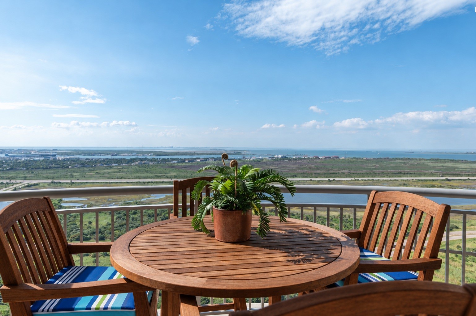 Private balcony off the bay-view primary suite offers a comfortable outdoor seating area high above the island. Private balcony off the bay-view primary suite offers a comfortable outdoor seating area high above the island.