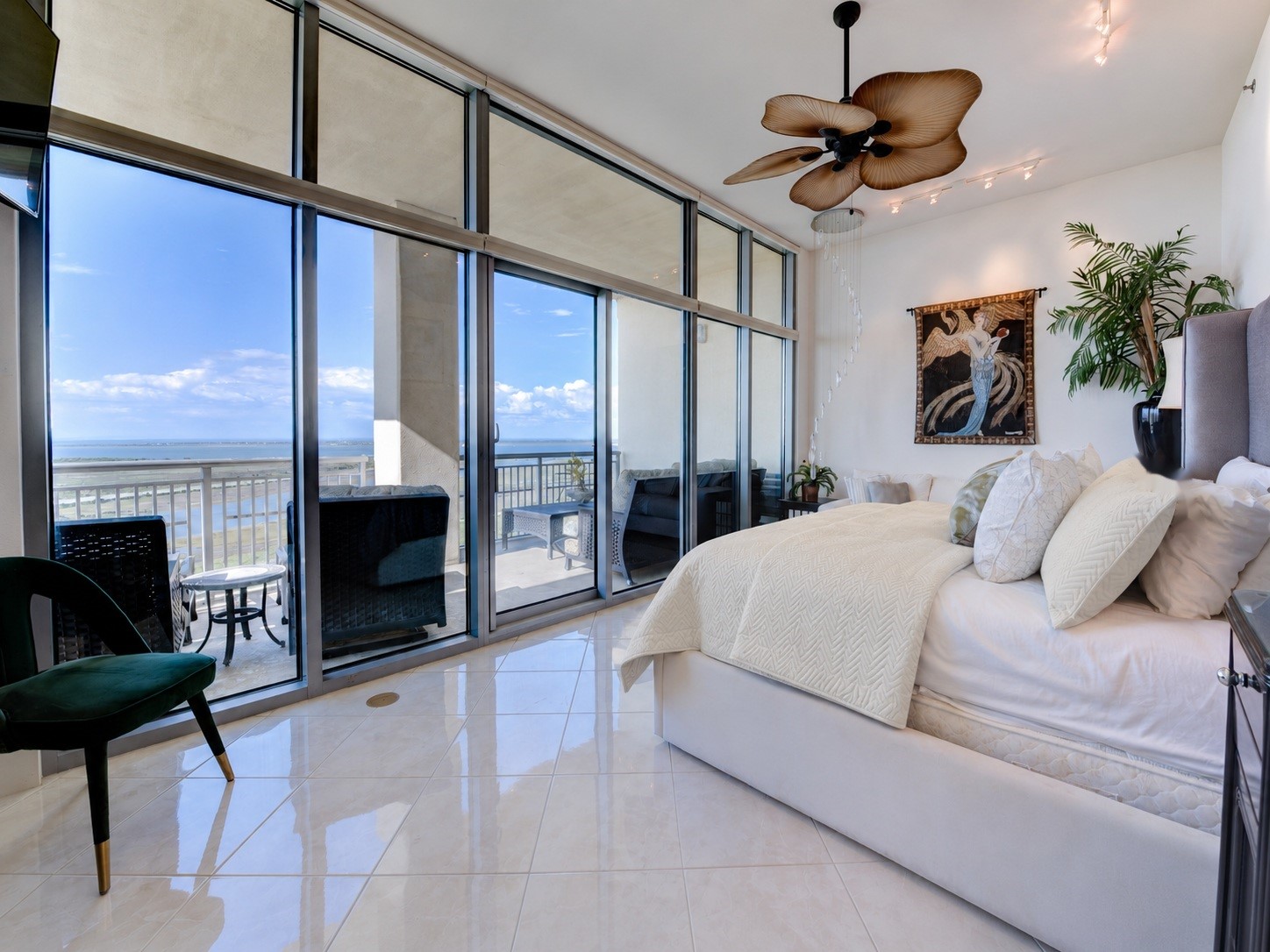 Spacious bay-facing primary suite offers expansive water views, direct access to a private balcony and a comfortable sitting area Spacious bay-facing primary suite offers expansive water views, direct access to a private balcony and a comfortable sitting area