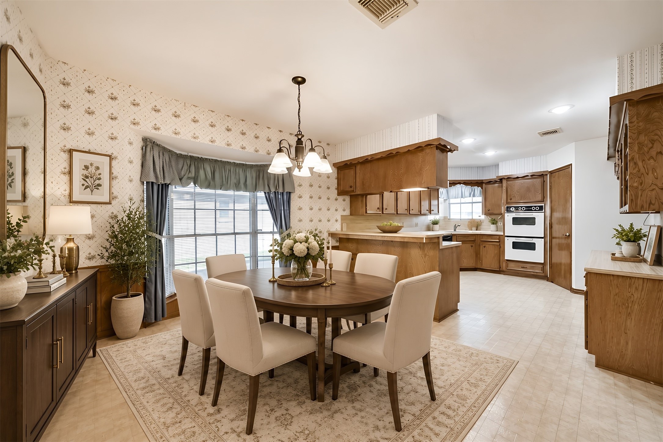 his spacious kitchen and dining area blends efficiency with timeless style. Staged in a transitional design, it showcases the possibilities for everything from quick morning breakfasts to relaxed evening meals and memorable gatherings with family and friends.