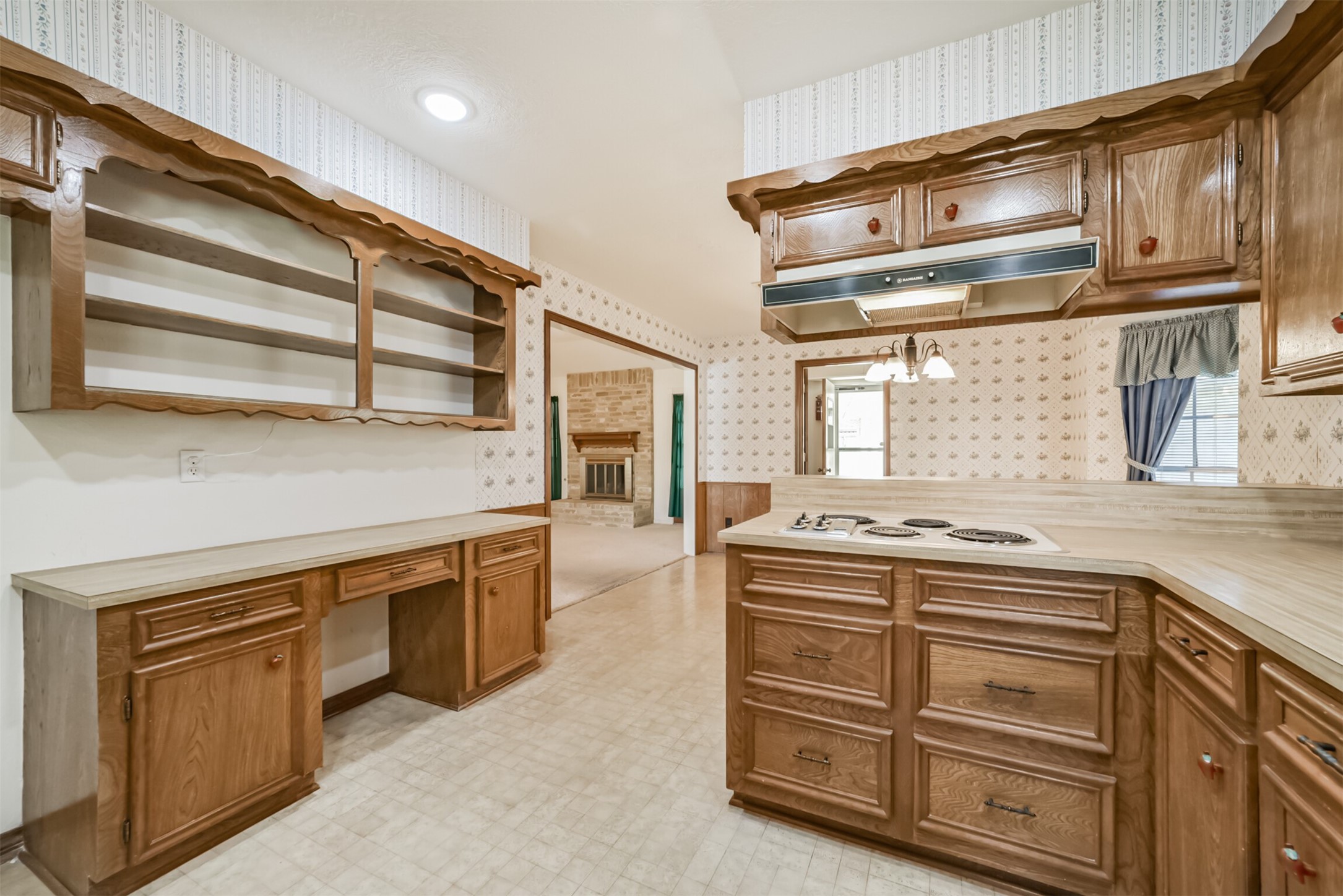 Here's a view from the kitchen into the dining area and a "peek" into the family room.