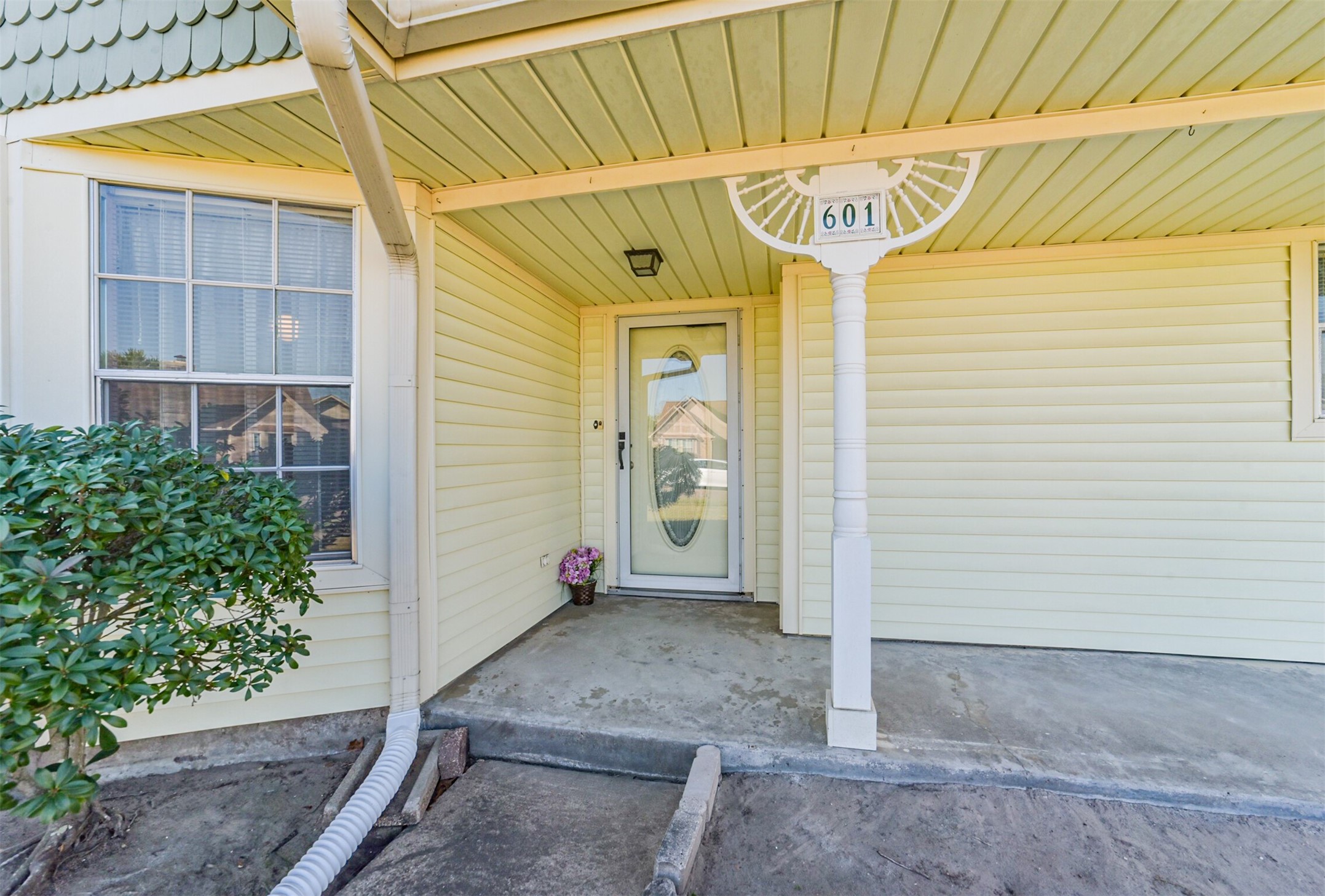 This is the front door entrance. A full glass storm door gives you the flexibility to open the door and let the sunshine in.