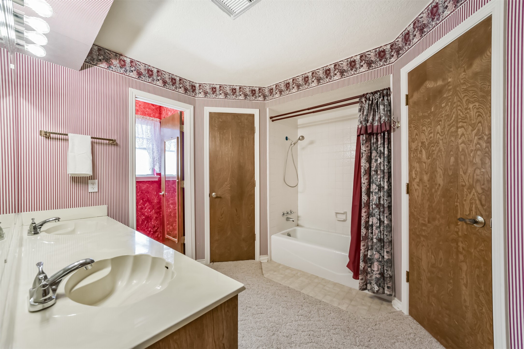 Start your day with comfort and convenience in this well-appointed primary bathroom! Two spacious walk-in closets provide plenty of room for your wardrobe and storage needs, while the dual-sink vanity makes busy mornings a breeze. A tub-and-shower combination adds everyday practicality, creating a space designed to keep up with your lifestyle.