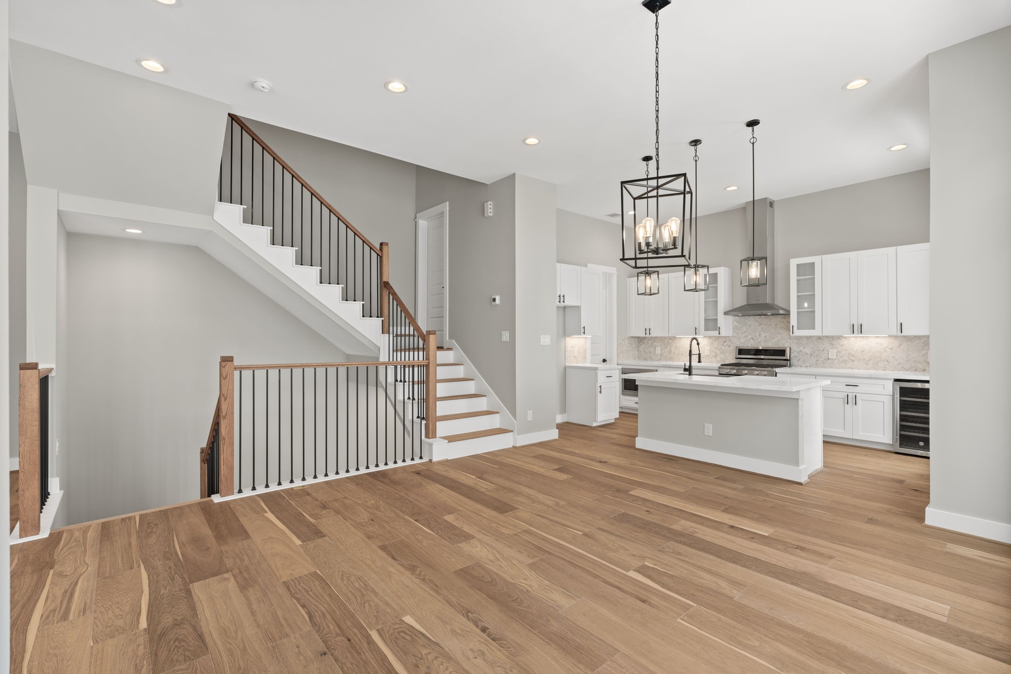 Enjoy the incredible natural light that shines through this living and kitchen space.