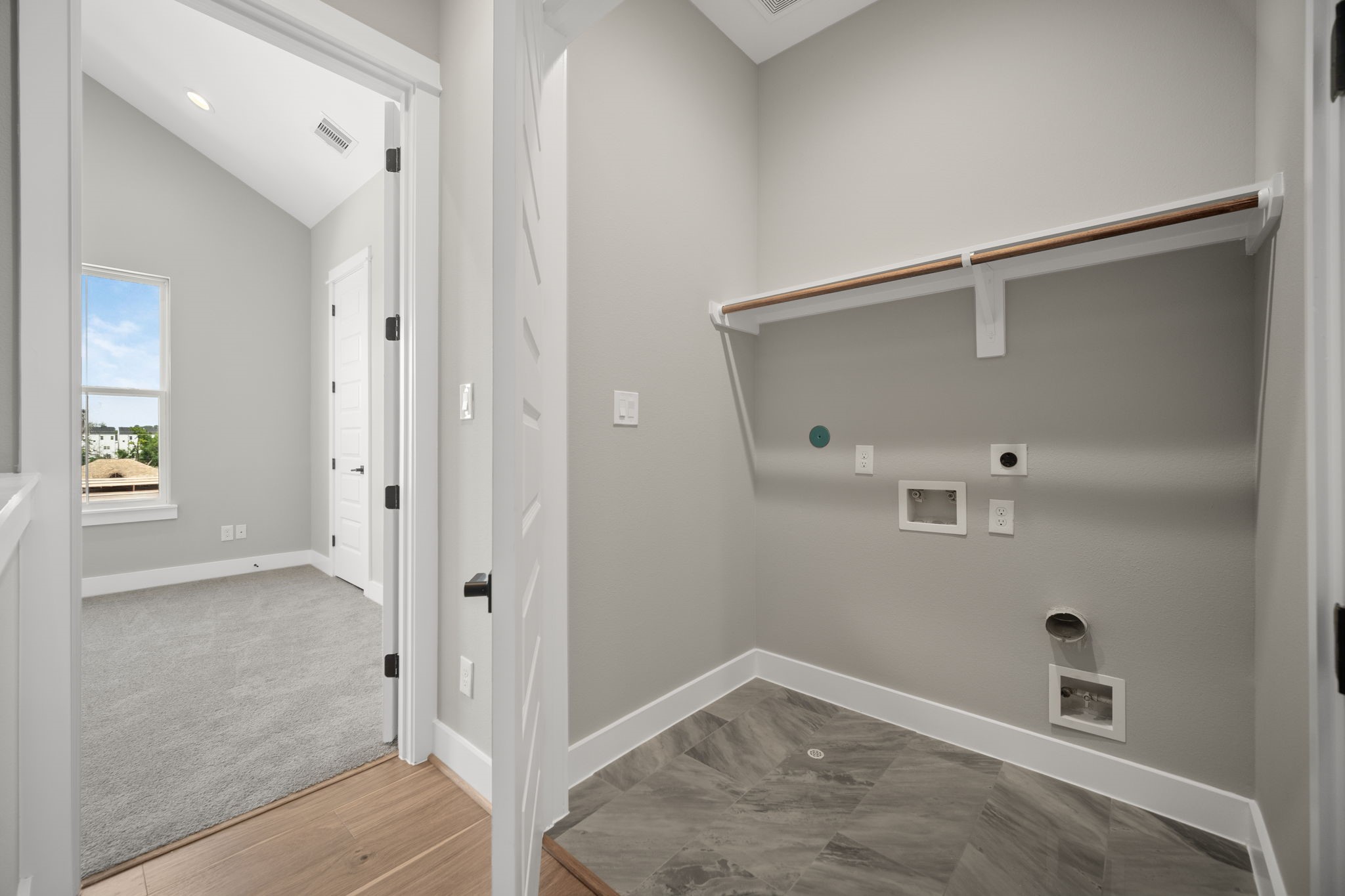 Utility room in house located on third level for convenience.