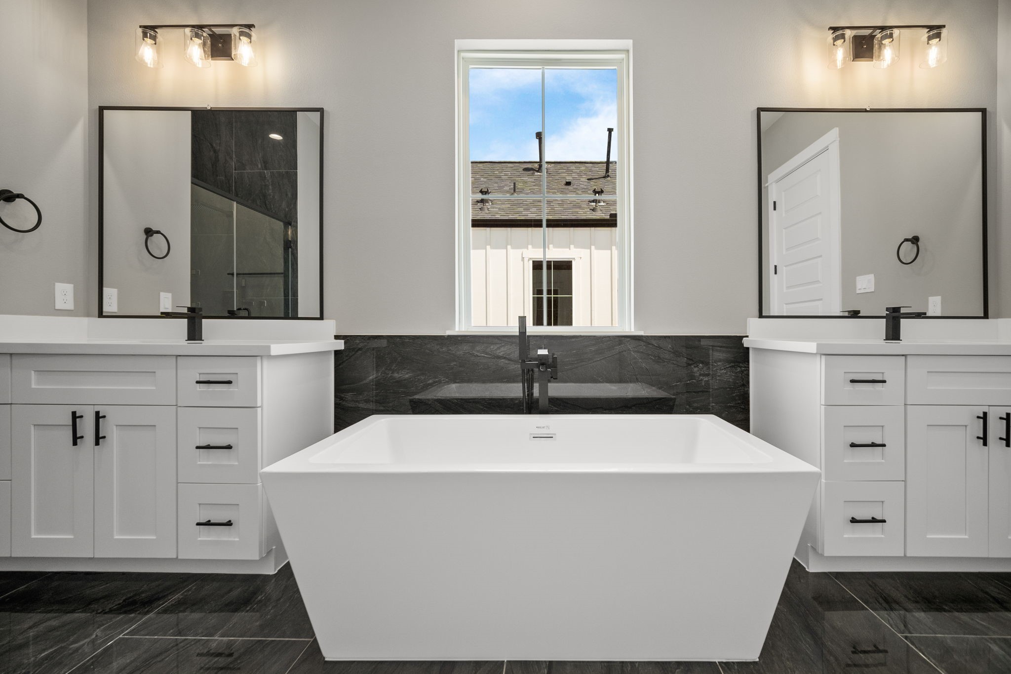 Spa like bathroom with his and her area sinks