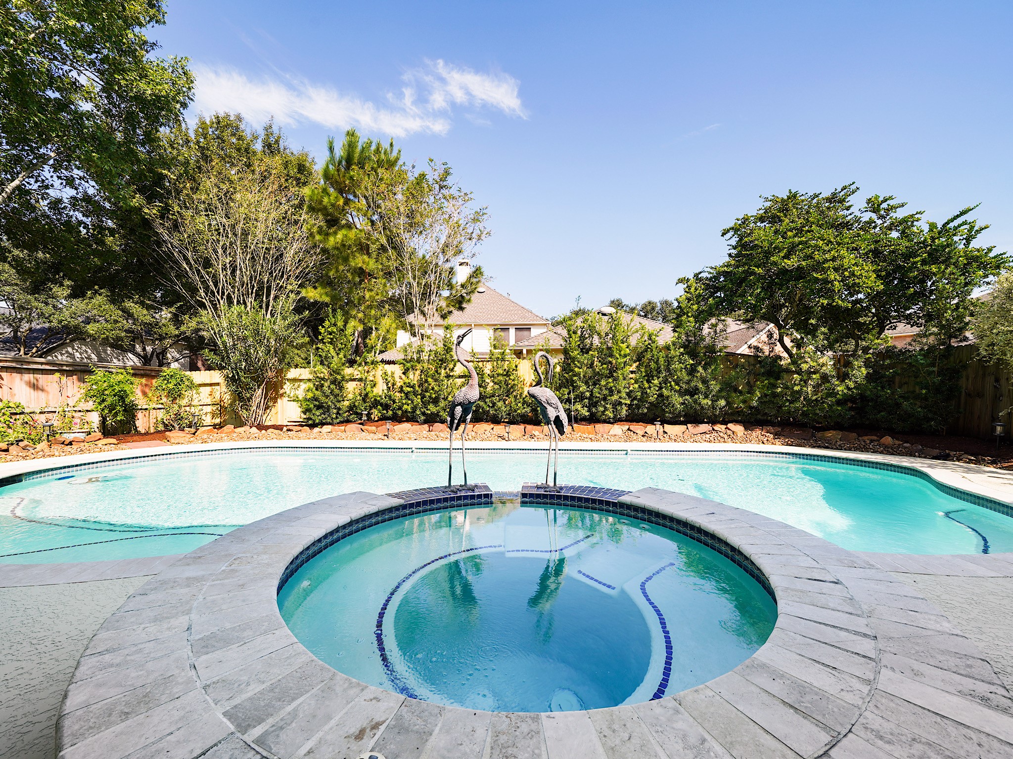 Make the most of sunny Texas days in your own heated pool. With the covered patio just steps away, this backyard is ready for relaxed afternoons and memorable gatherings.