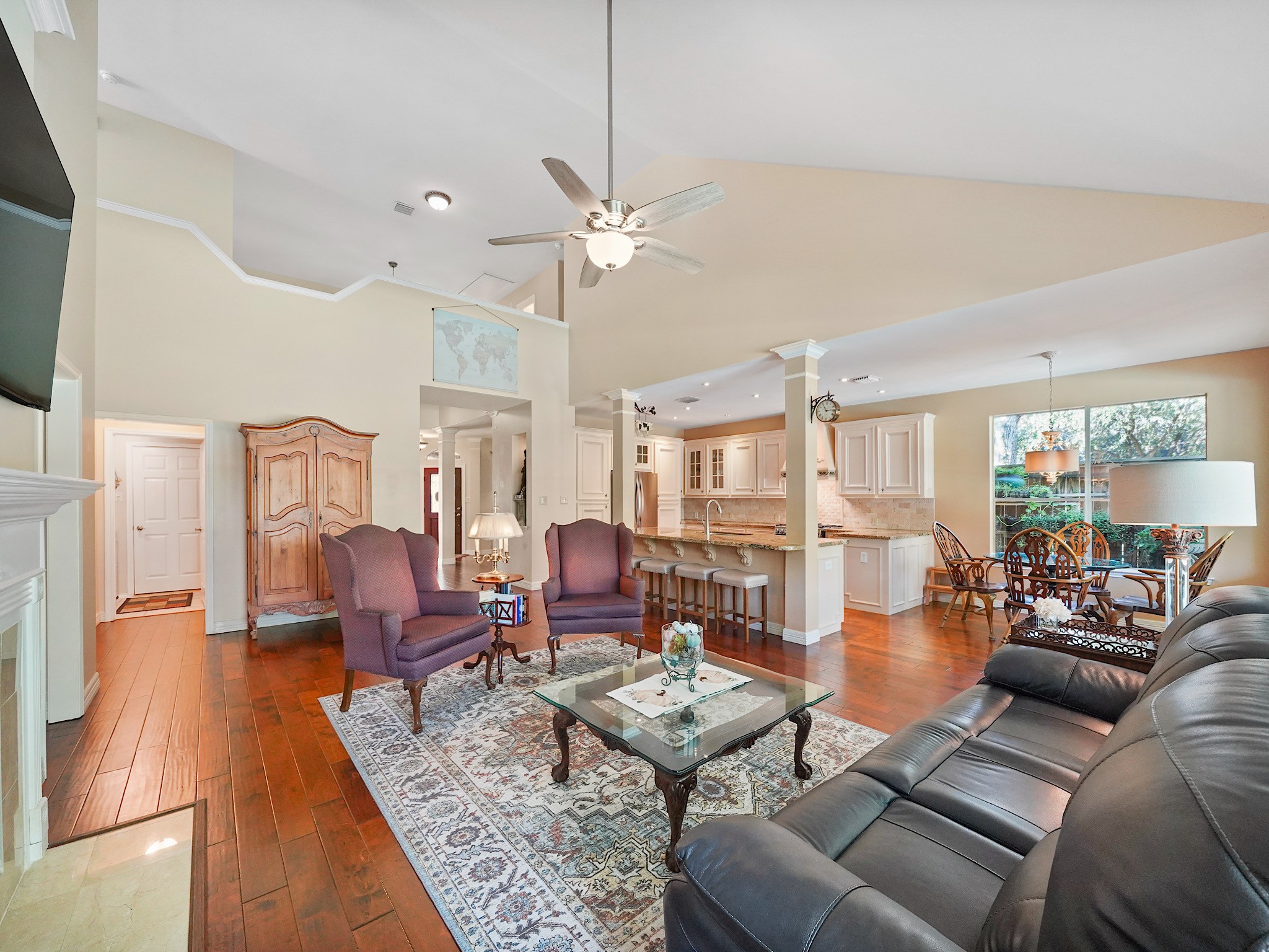 The open connection between the family room and kitchen keeps everyone close, whether dinner is being prepared or the conversation has moved to the sofa. Its a layout made for easy gatherings and everyday moments.