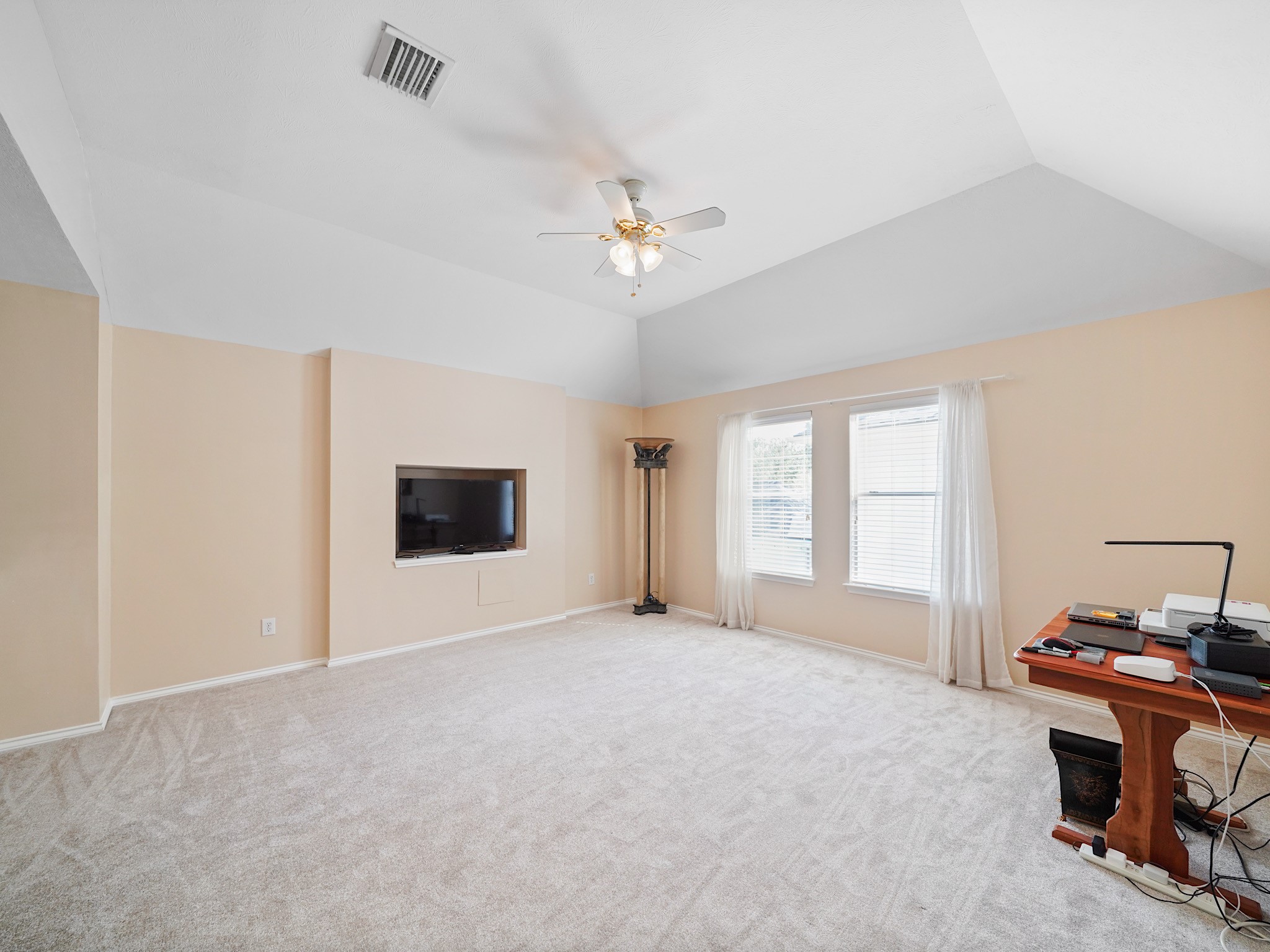 Windows bring natural light into the game room, while the generous layout gives you flexibility to create a space that fits your lifestyle. Its an inviting spot for movie nights and weekend fun.