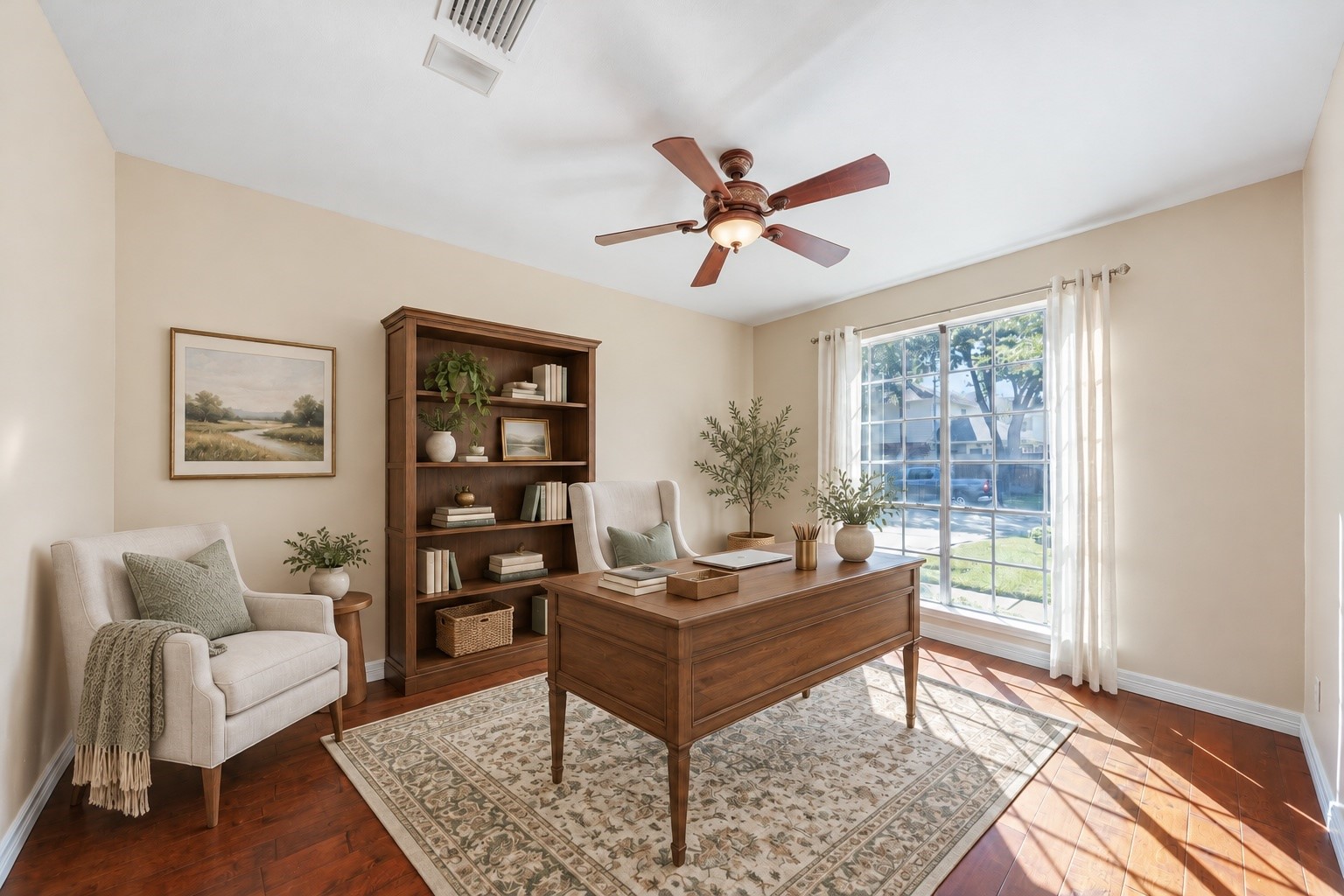 Virtually Staged: The front room is styled as a welcoming home office, with natural light and the flexibility to create a space that suits your needs.