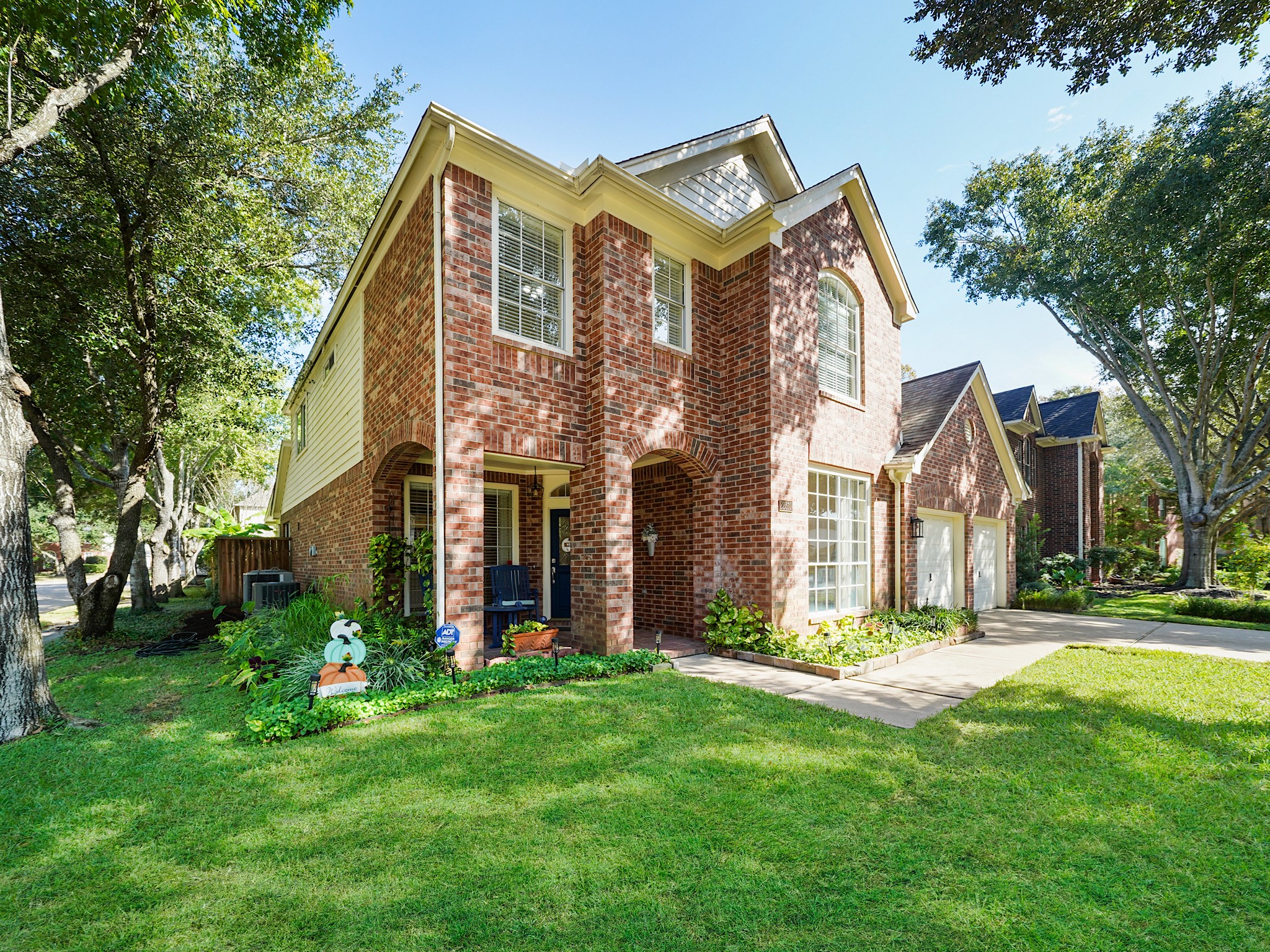 Mature trees and a corner-lot setting add to the homes welcoming curb appeal. Beyond your front door, enjoy the amenities of Cinco Ranch, including parks, trails, pools, and recreation.