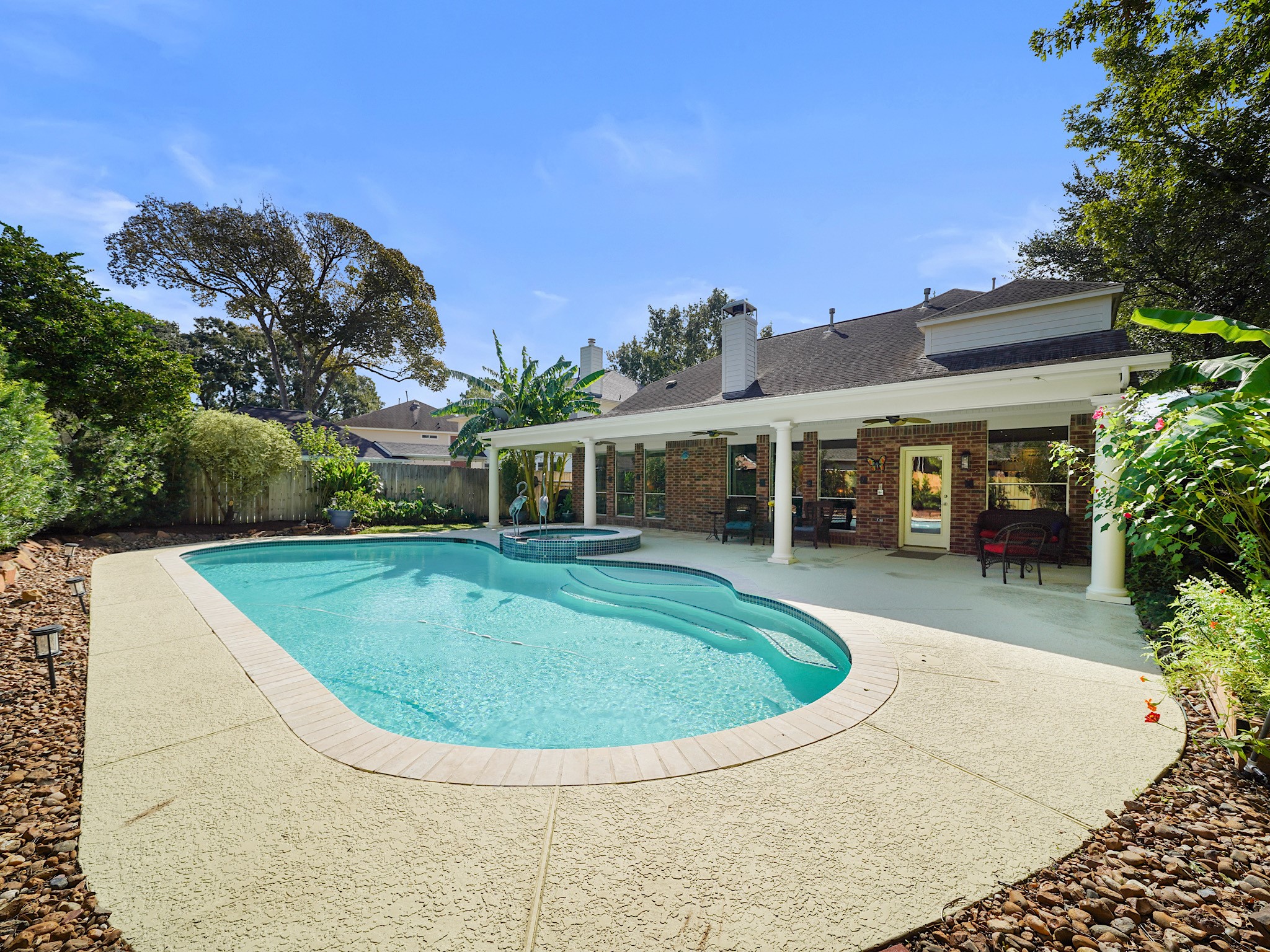 Enjoy a refreshing swim or settle into the attached spa as the day winds down. This backyard retreat brings a little vacation feeling home.