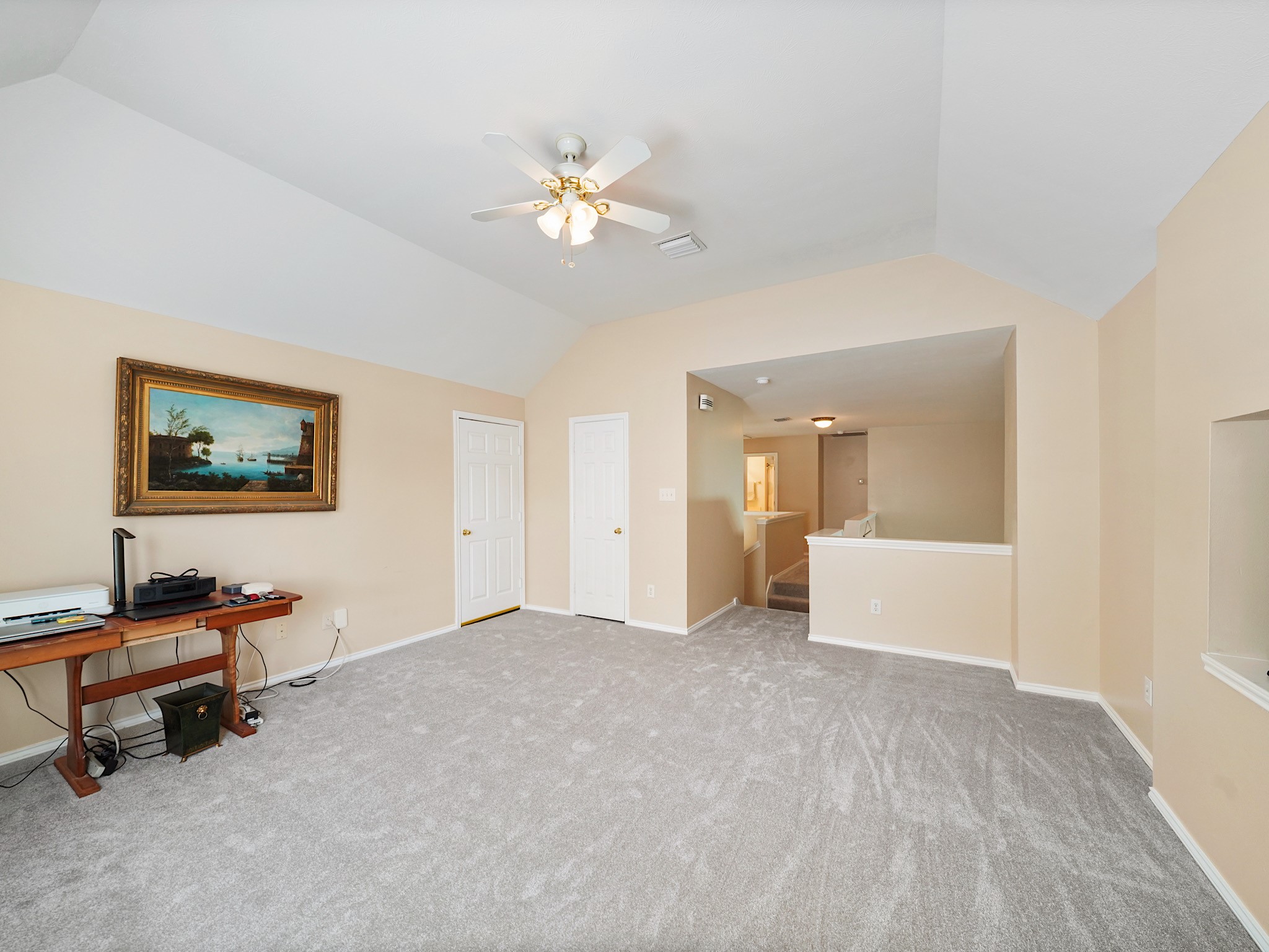 Upstairs, a spacious game room offers another place to gather, play, or simply relax. Make it your own with a comfortable lounge, game tables, or space for favorite hobbies.