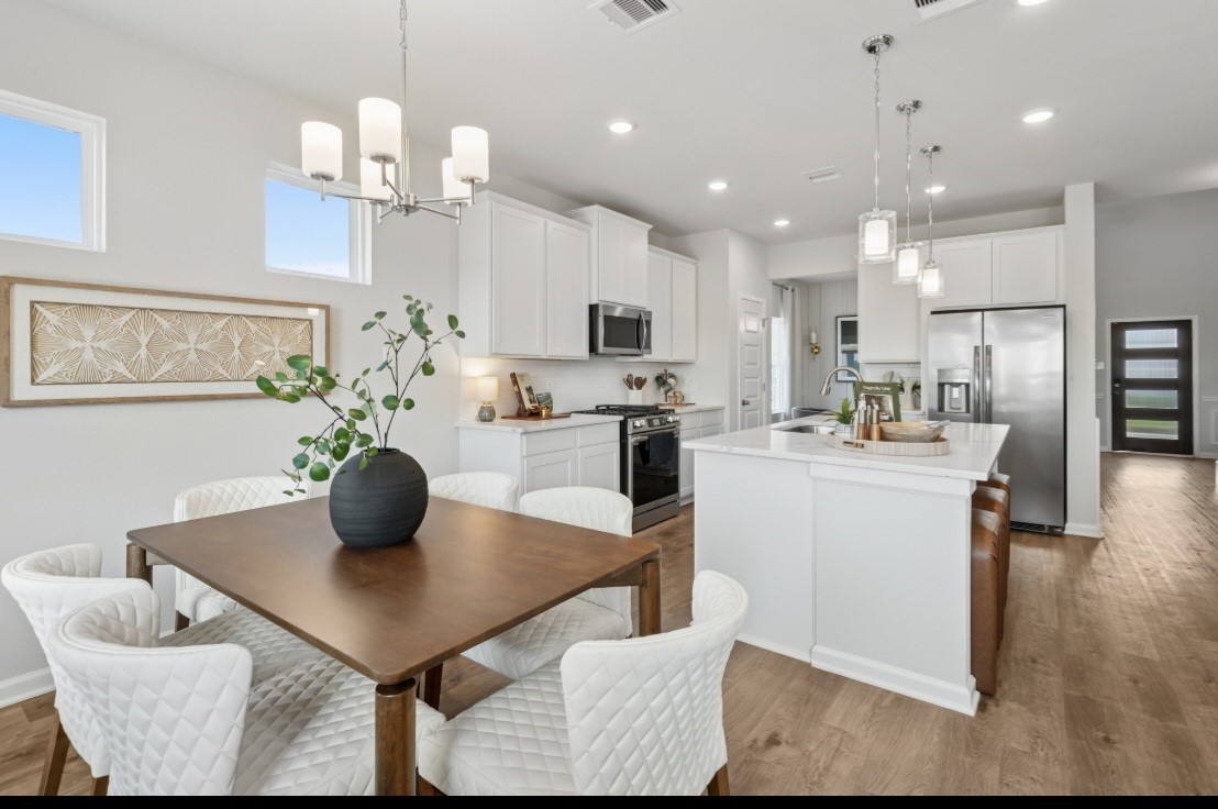 This image of the kitchen/breakfast is staged to be used for illustration purposes only.