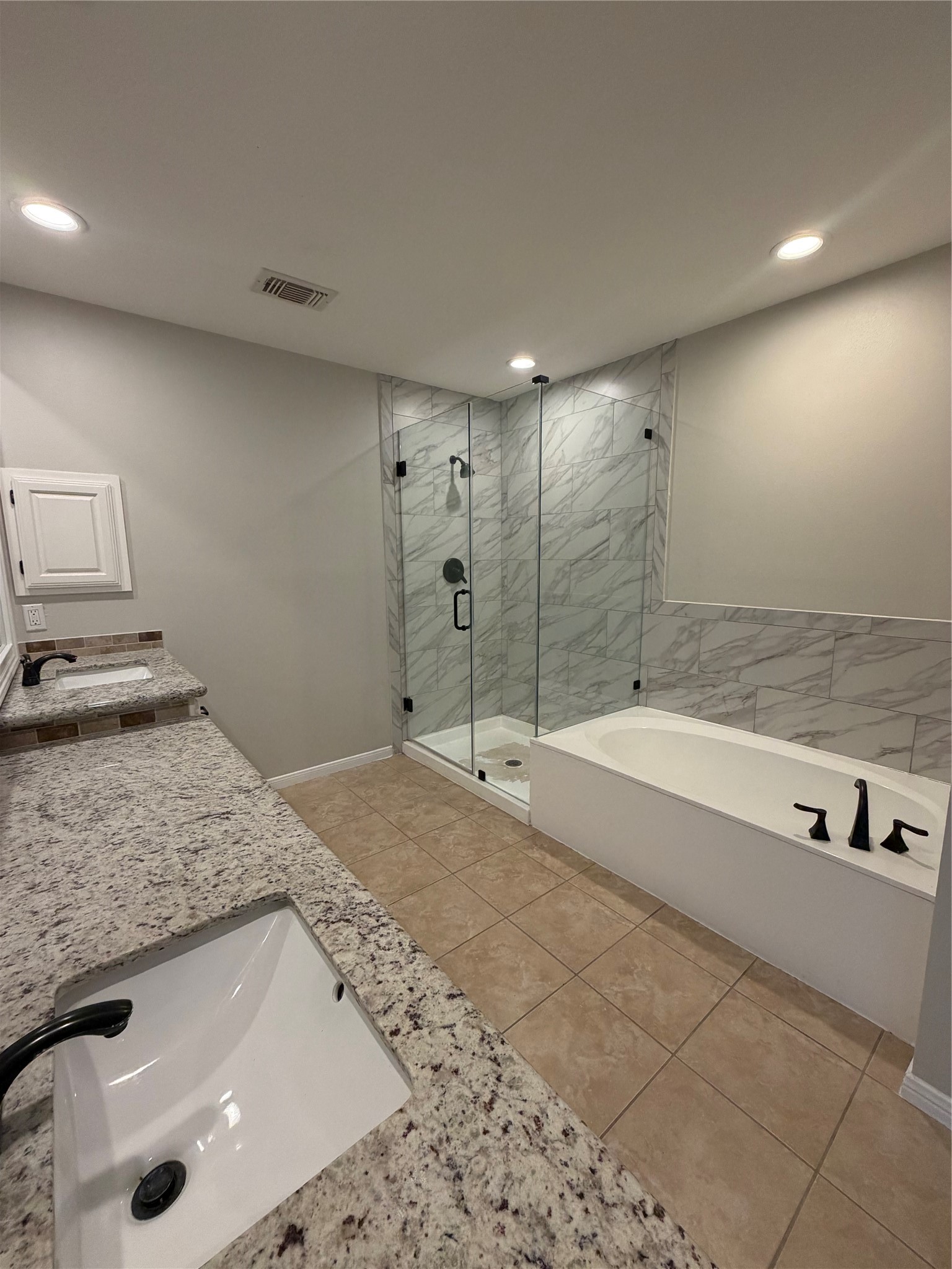 Primary bath with separate shower and tub