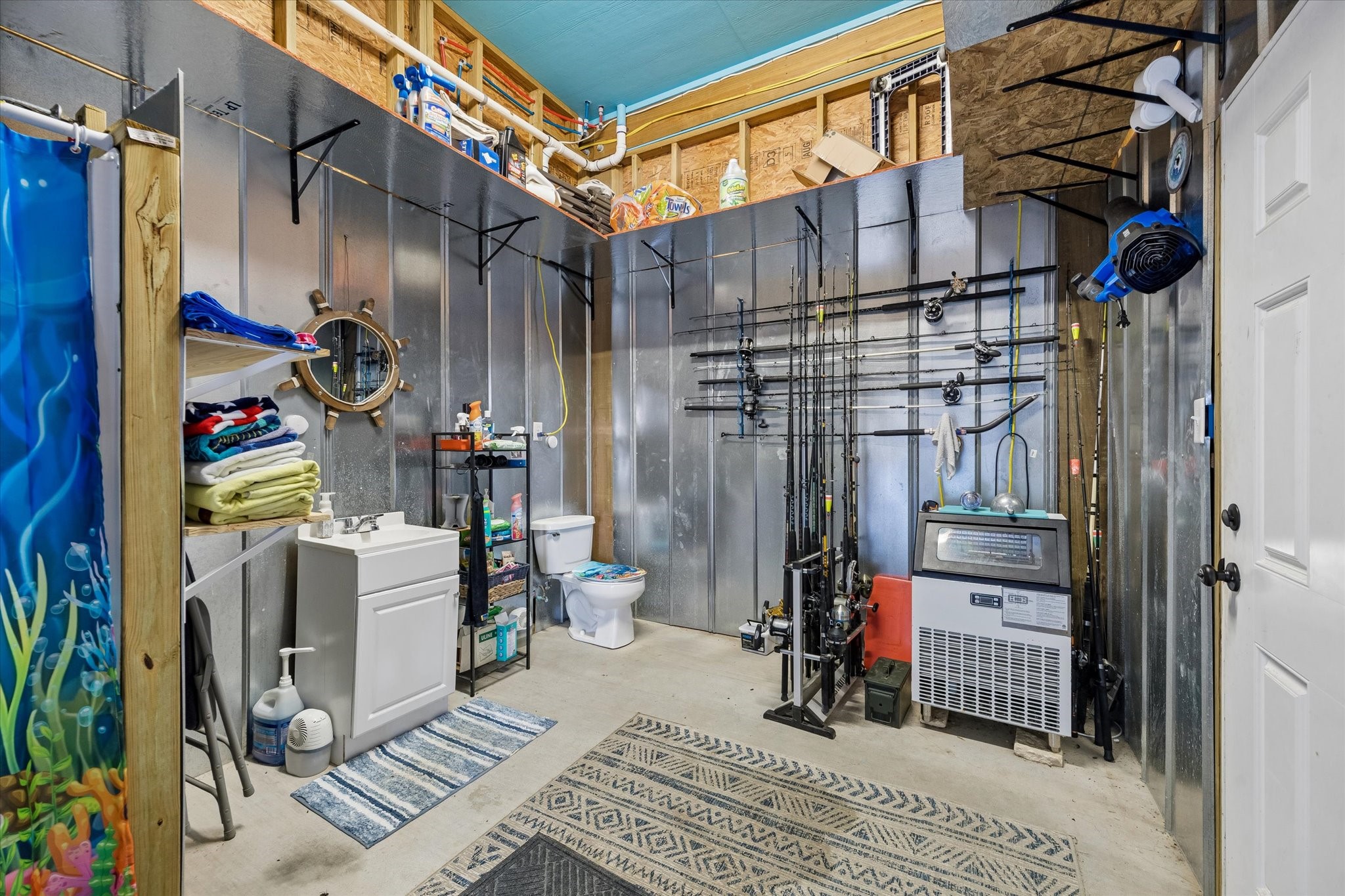 Spacious downstairs bathroom with ample storage, perfect for organizing essentials while enjoying convenience and functionality.