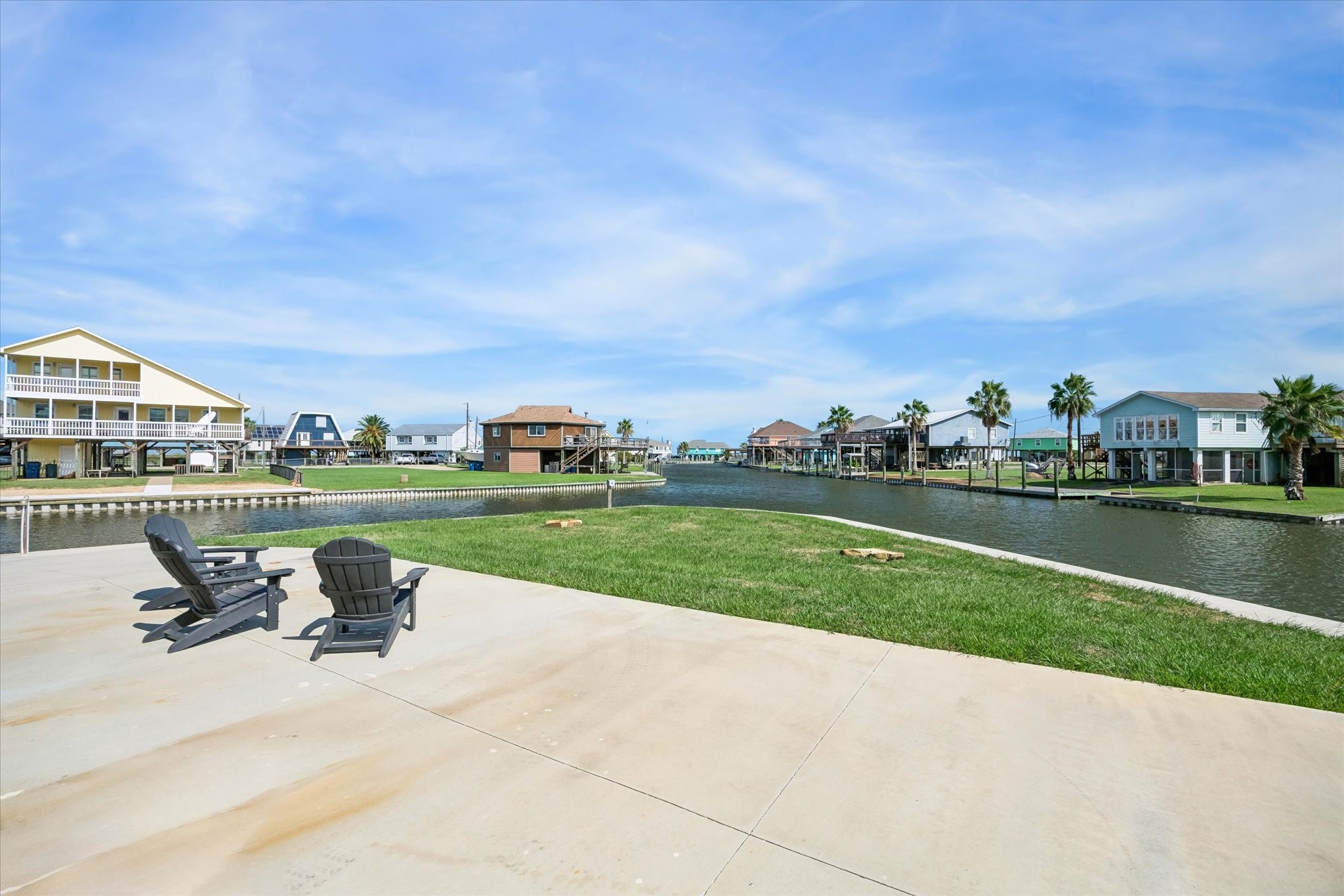 Enjoy serene waterfront 180 degree view with direct access to the canal, perfect for relaxing or outdoor activities.