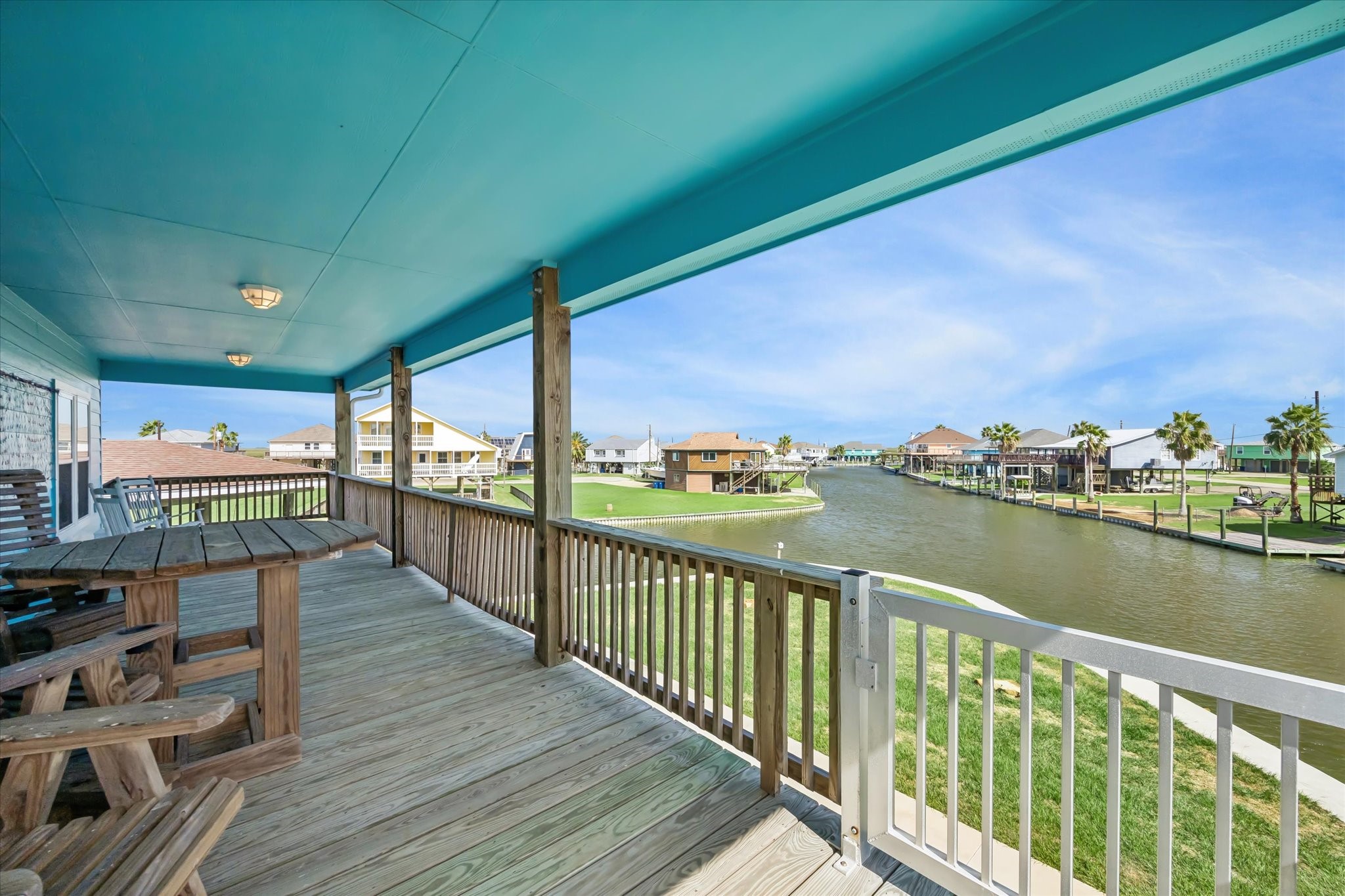 Expansive waterfront balcony offers breathtaking canal views, ideal for relaxation and entertaining.