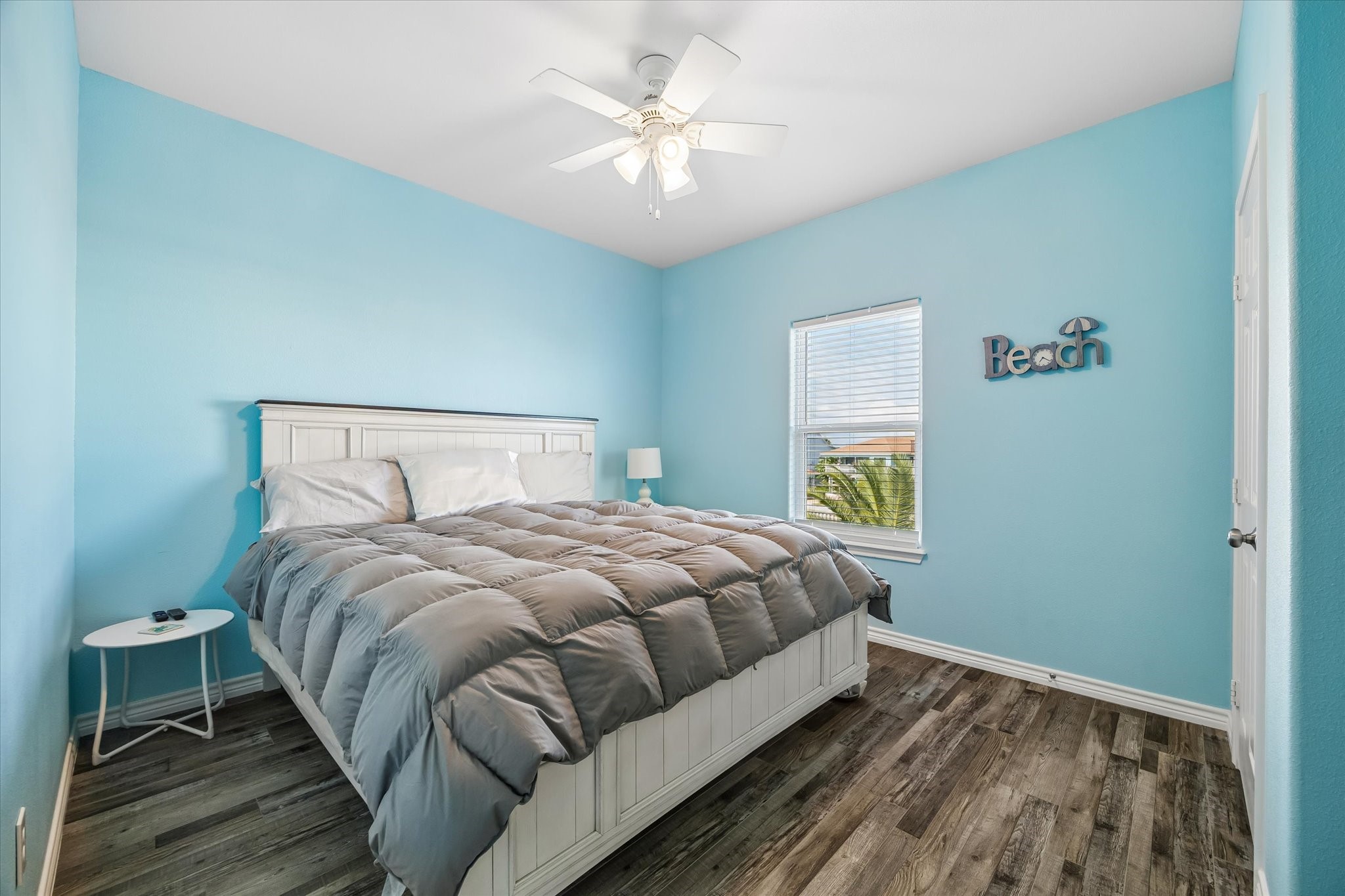 Experience serene comfort in this inviting bedroom with soothing blue tones, featuring an en suite bath for ultimate convenience.