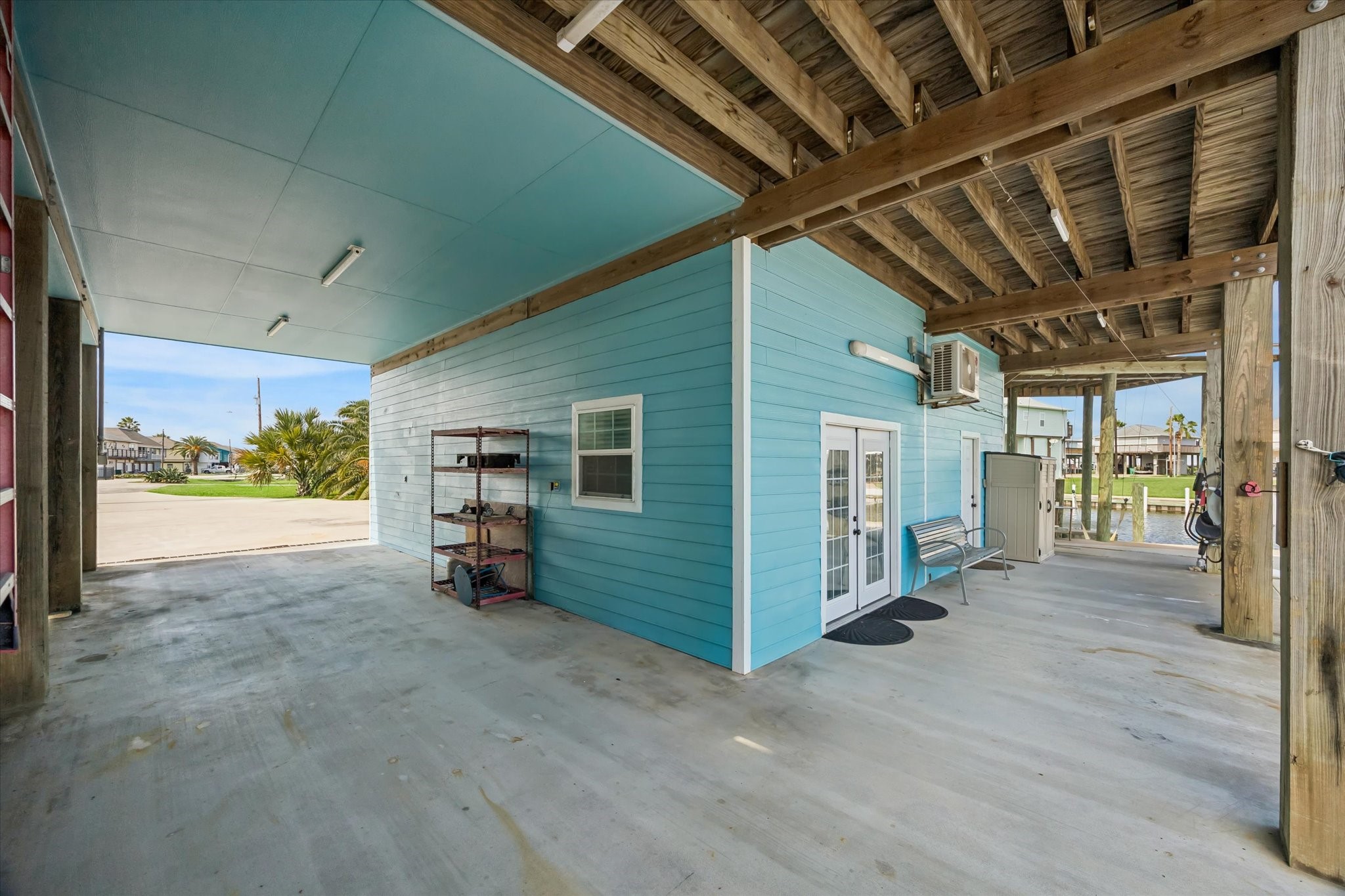 Charming coastal retreat with a spacious covered patio, perfect for relaxing by the water.