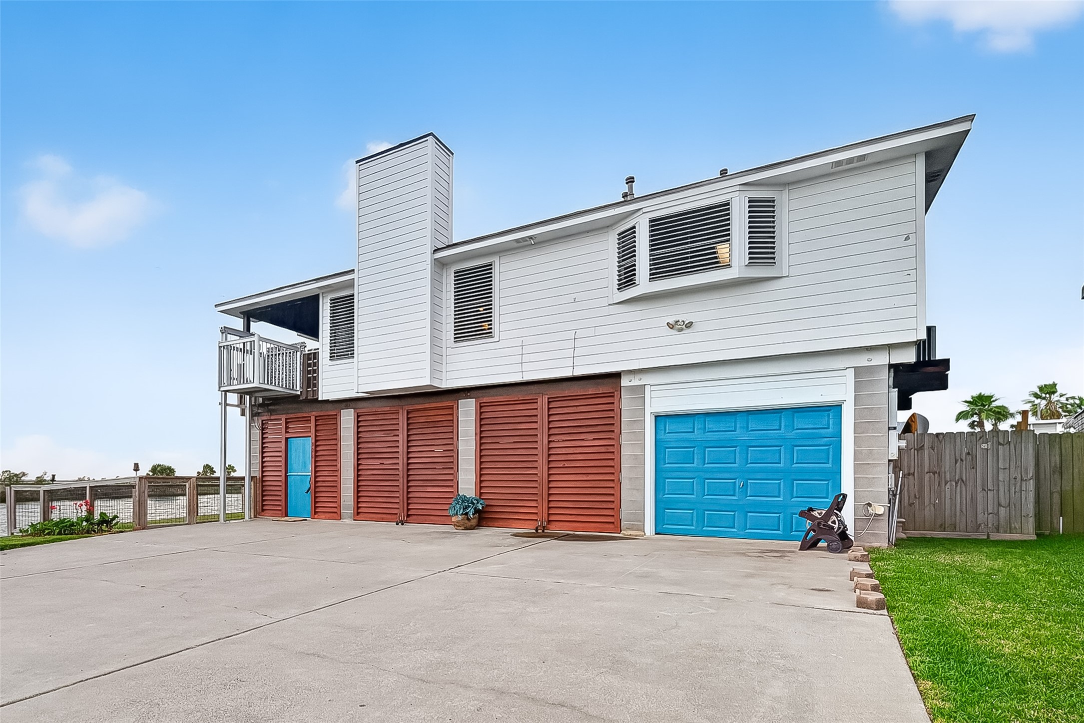 Welcome home! Two car garage as well as covered parking behind both sets of louvers!