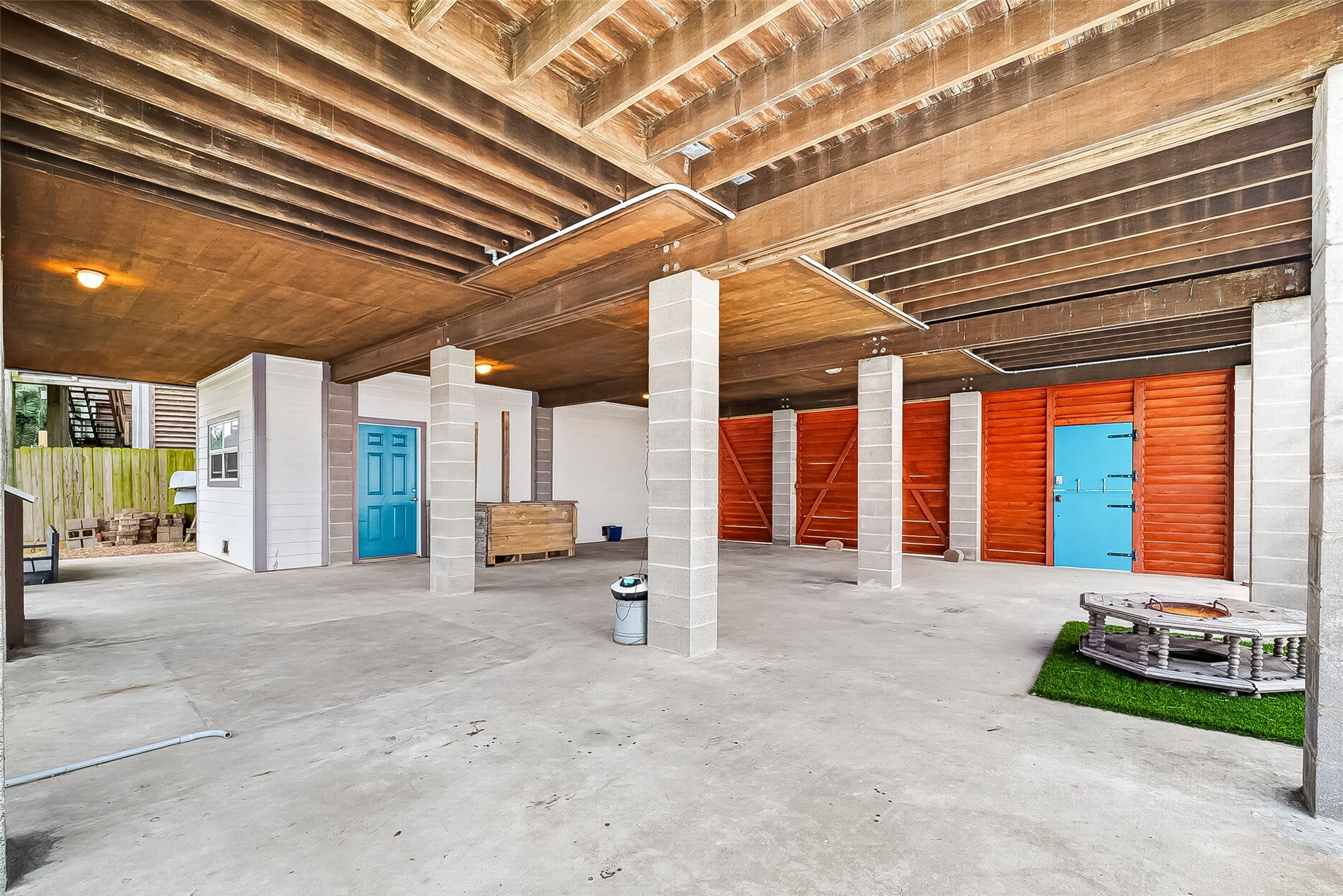Enclosed garage with room for two cars! Covered additional space under house fully usable