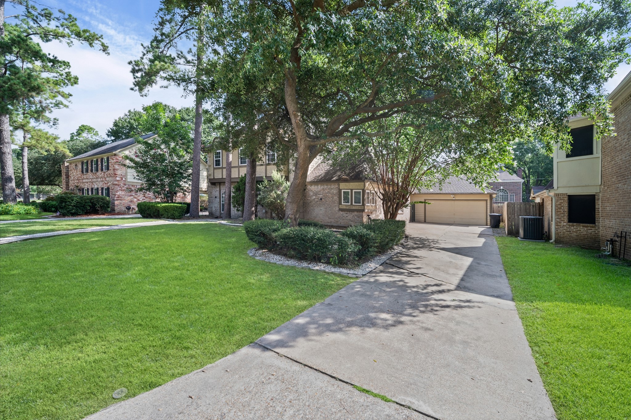 A massive front lawn and extra long driveway greets you.