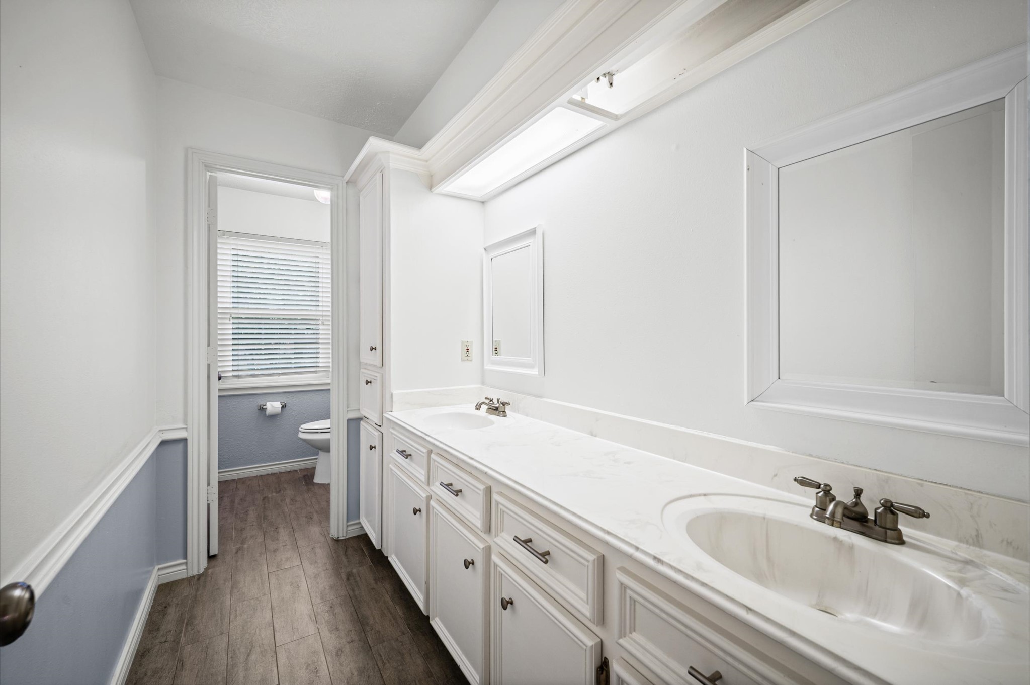 Secondary bathroom has fabulous updates with new tile, countertops and tiled shower/bath