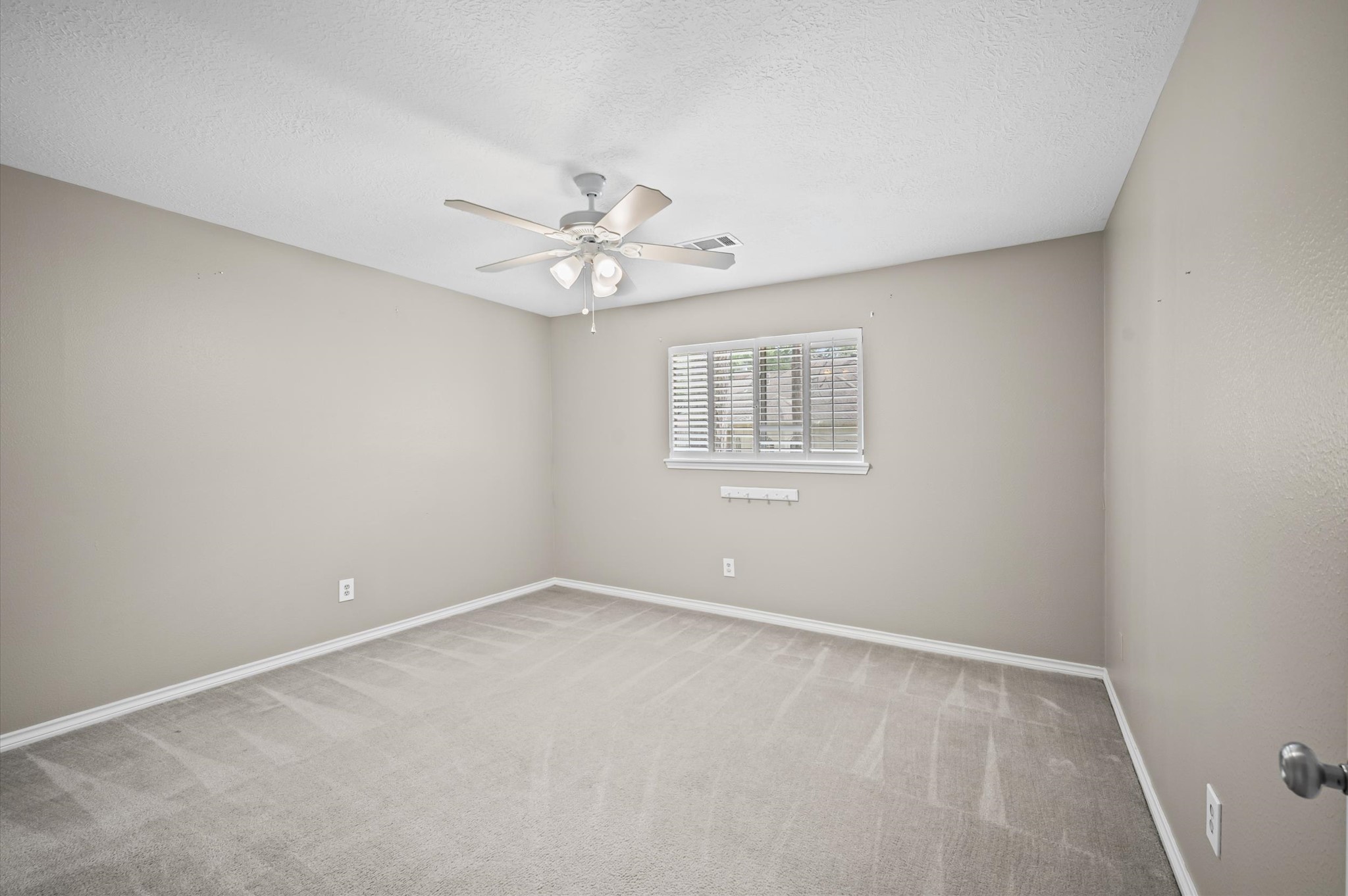 Spacious secondary bedroom located upstairs has great sized walk-in closet.