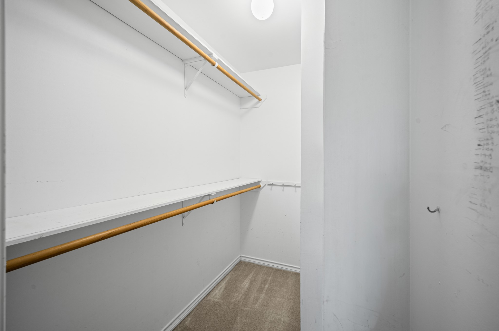 Another spacious secondary bedroom located upstairs with walk-in closet.