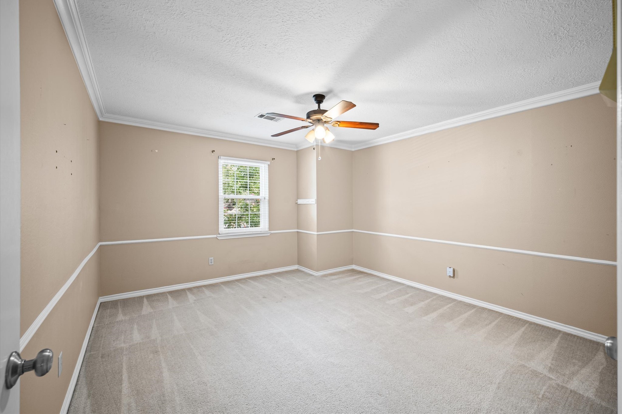 Another spacious secondary bedroom located upstairs with walk-in closet.