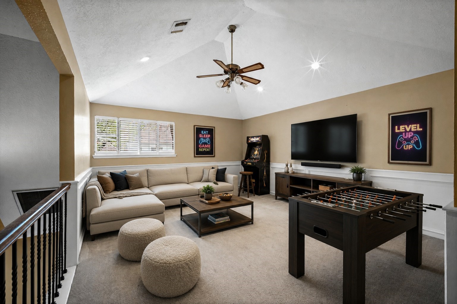 Game room virtually staged to show furniture and decor possibilities.