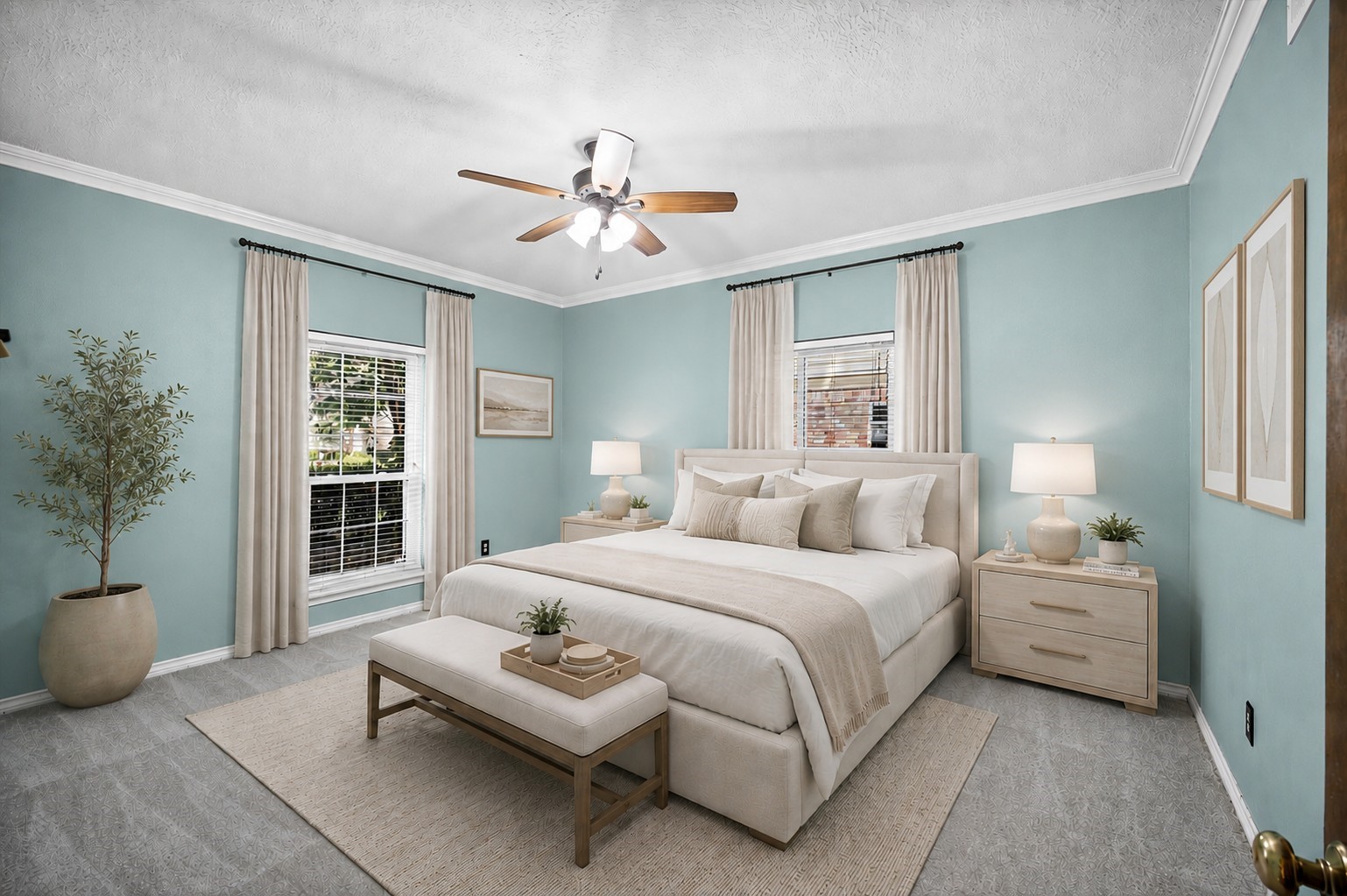 Primary bedroom virtually staged to show furniture layout and decor possibilities.