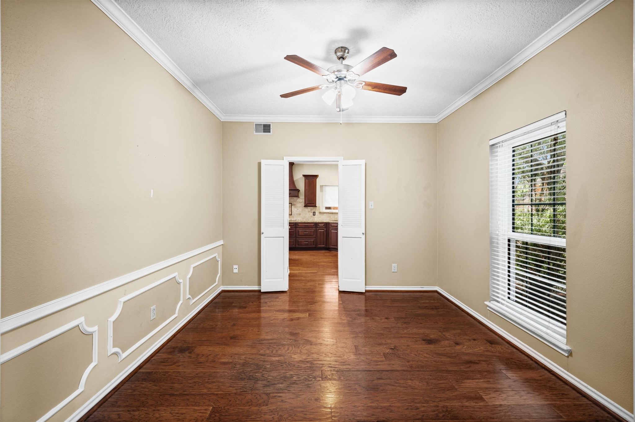 This versatile space could be used as a study or as a formal dining room.