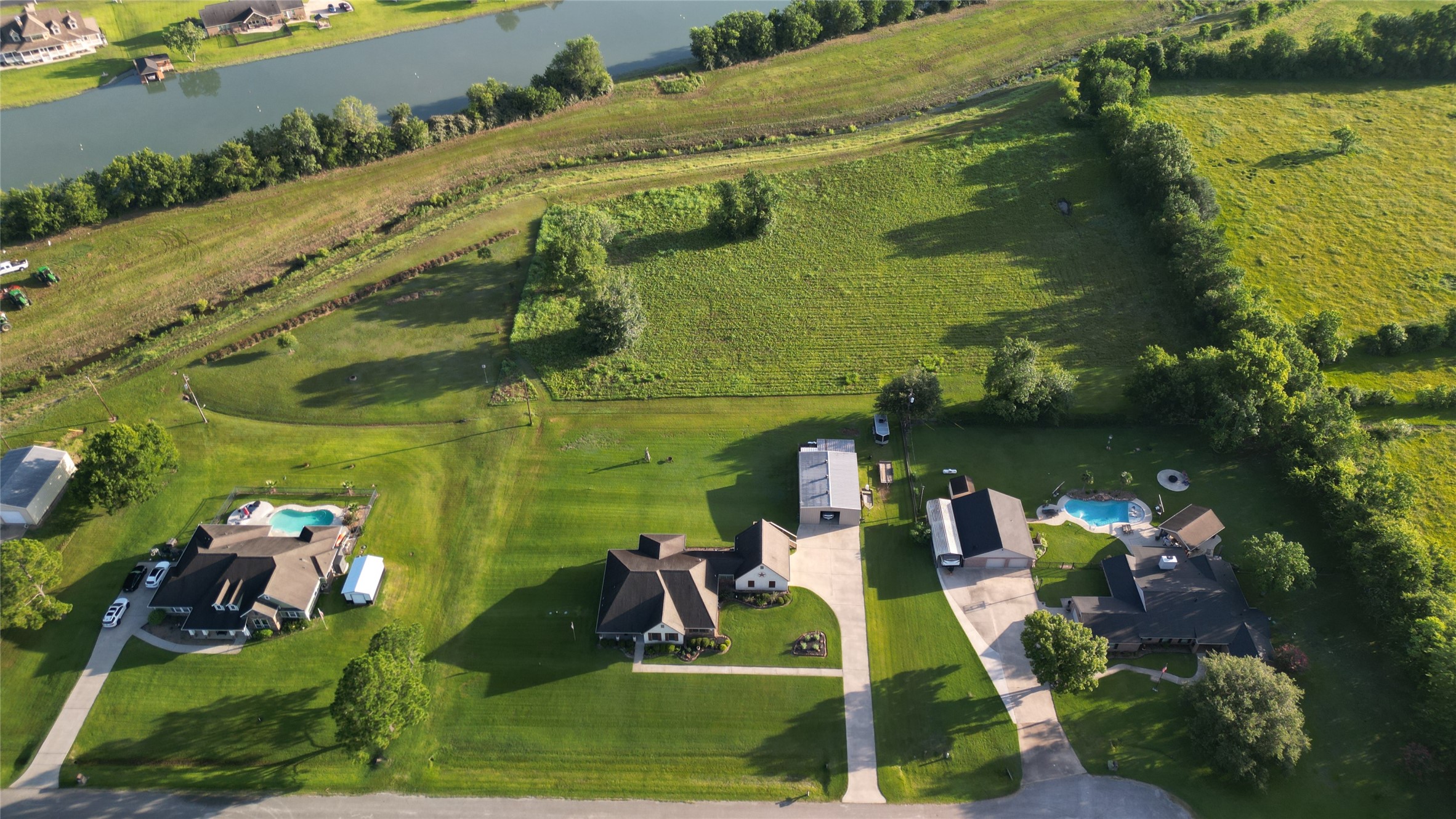 Property located behind the homes in front of the lake.