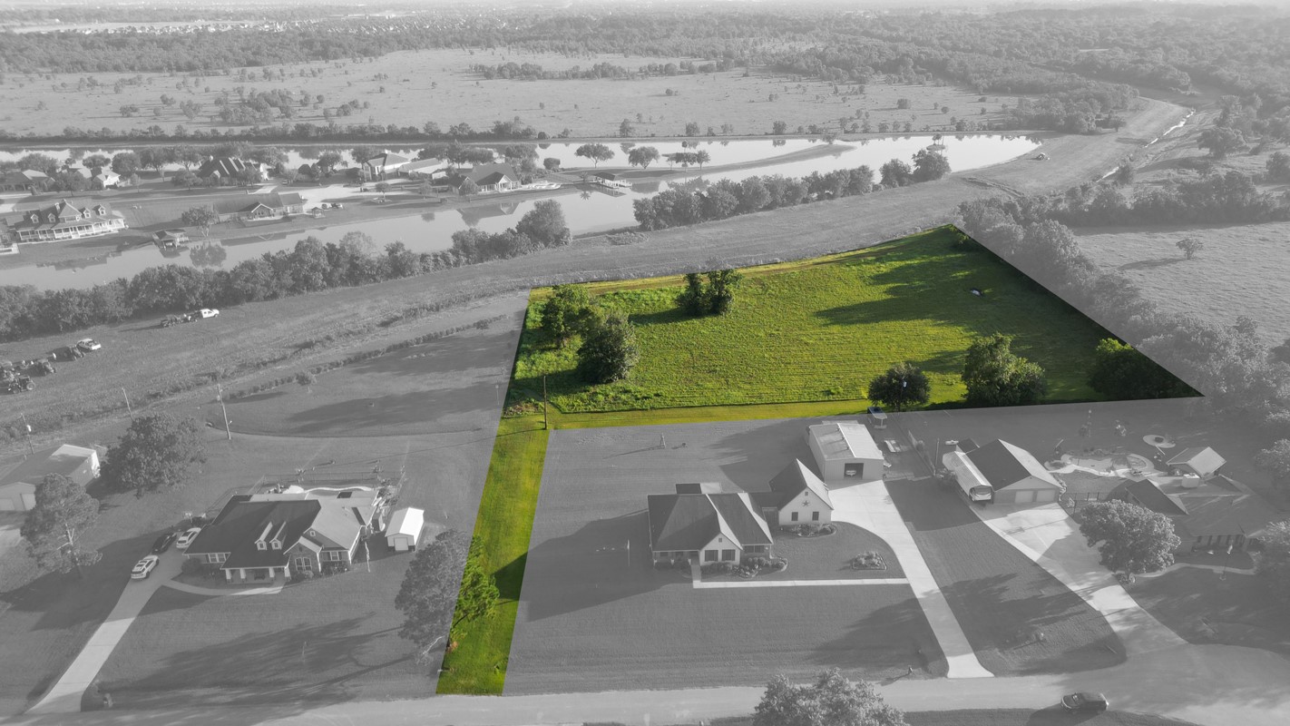 This view shows the long driveway leading back to over 4 acres of land. Boundary lines are approximate.