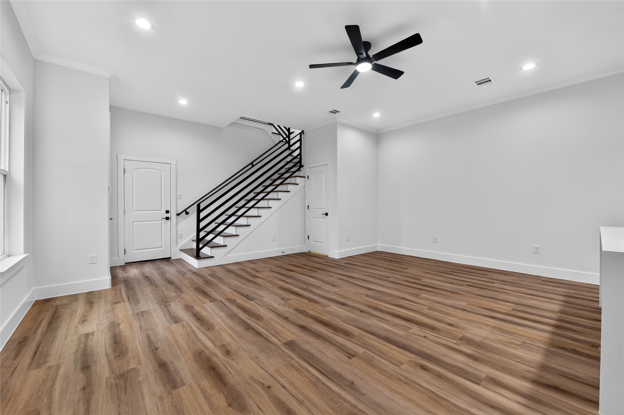 Thoughtfully designed--convenient garage entry opens directly into the living spaces, while steps to the side lead upstairs to the bedrooms and baths.