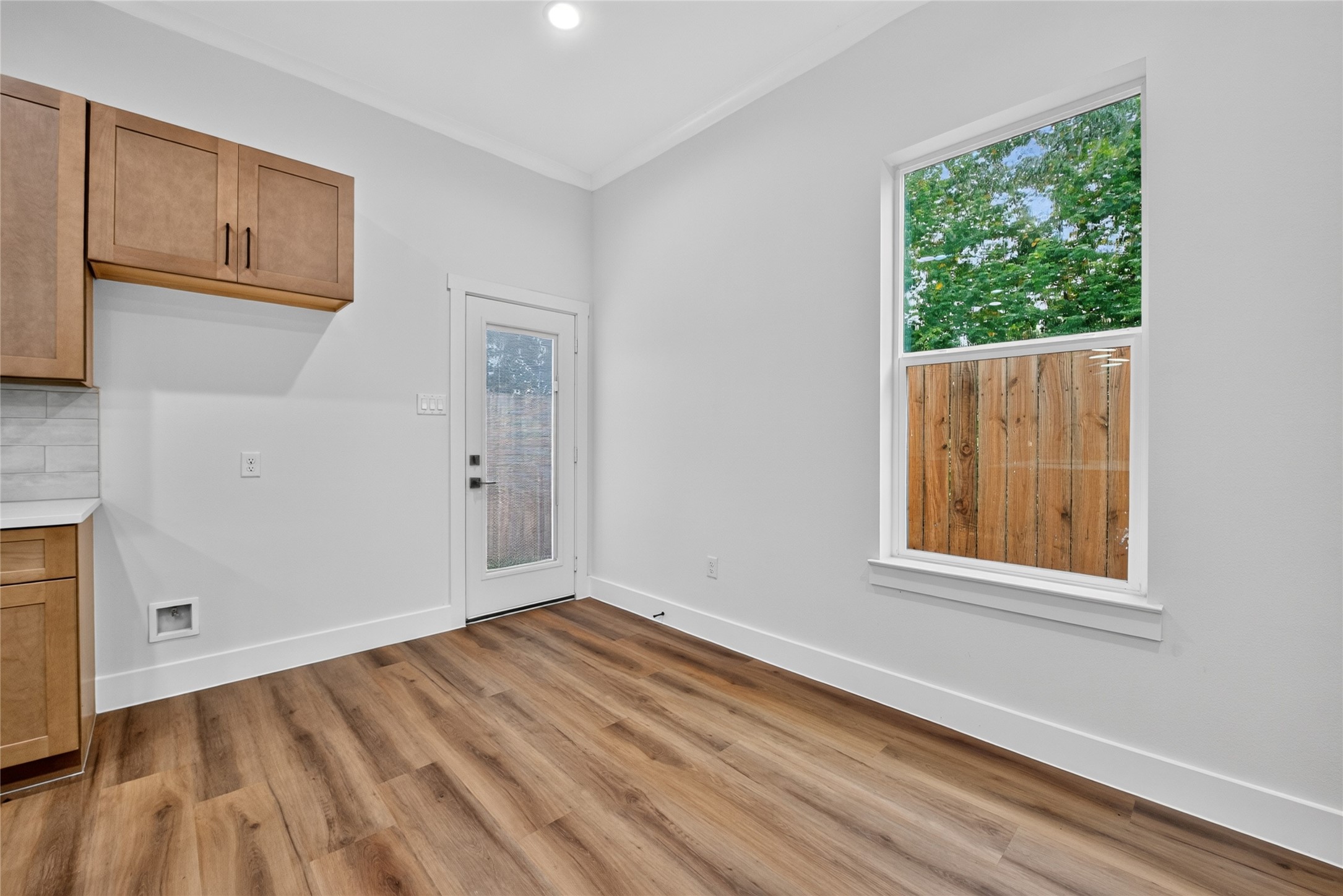 A bright, inviting dining space just off the kitchen, with direct access to the private backyardideal for everyday meals and entertaining.