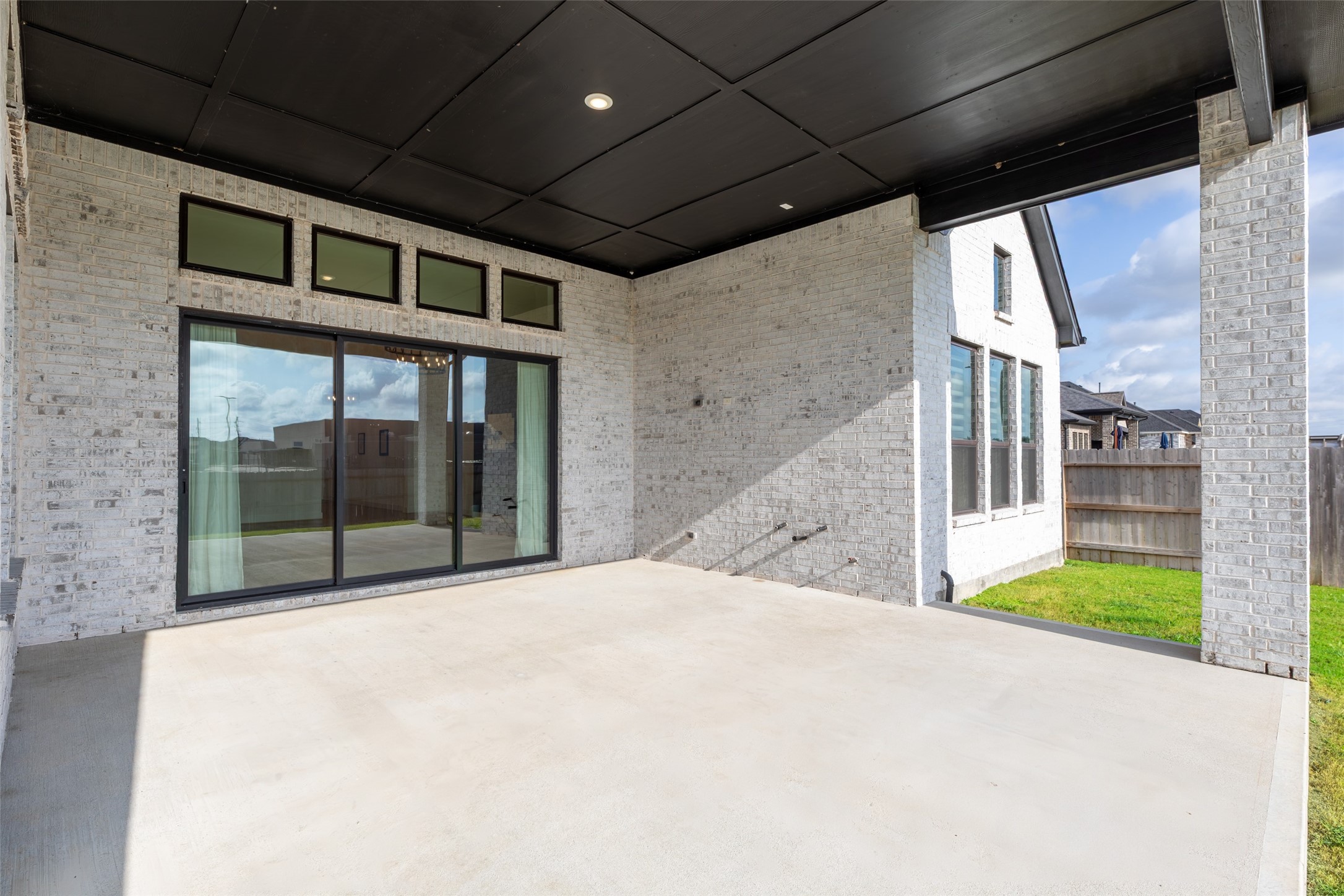 Sliding glass doors and a view of the backyard, perfect for outdoor entertaining.
