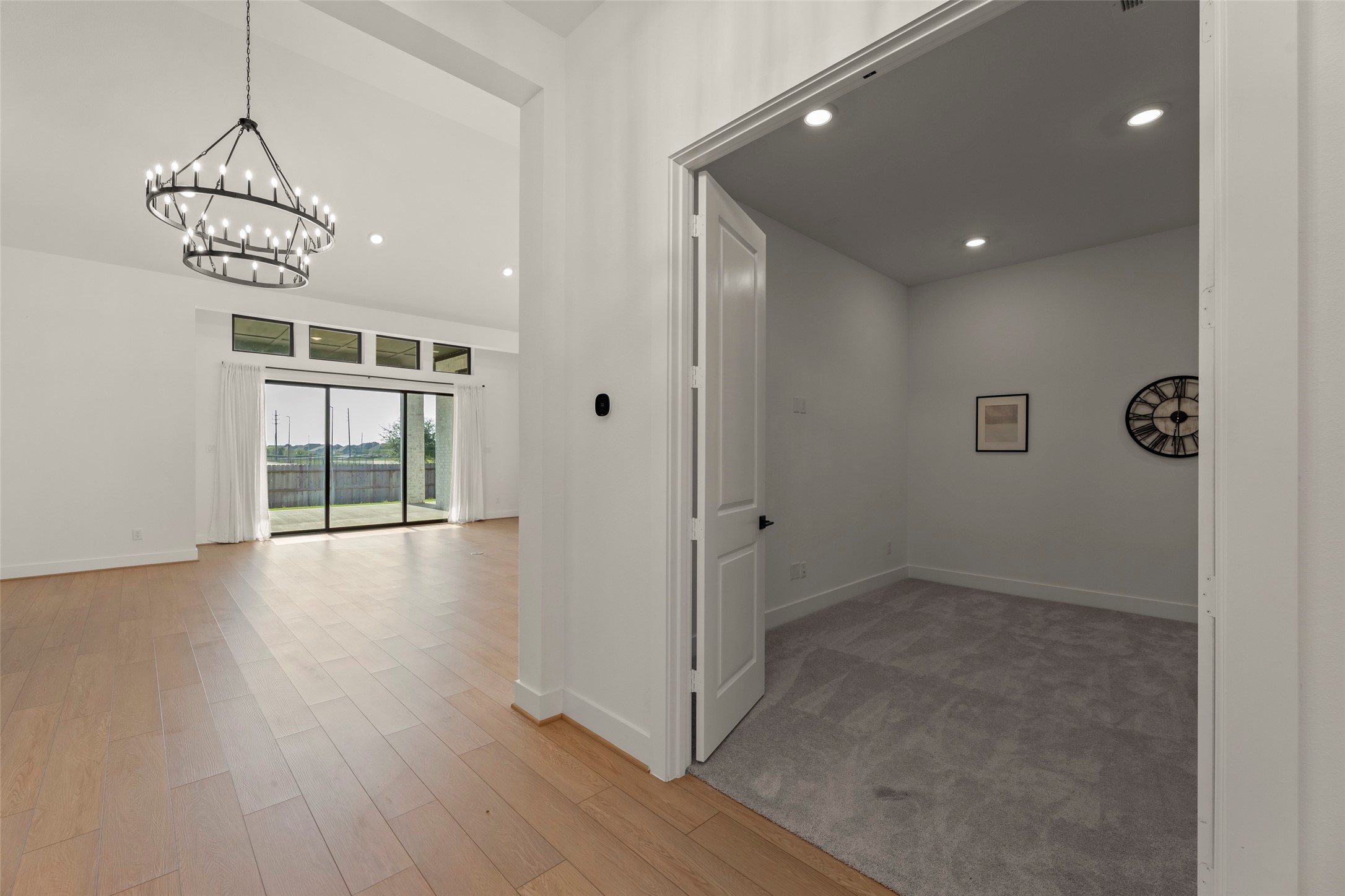 Adjacent room offers versatile space for an office or study.